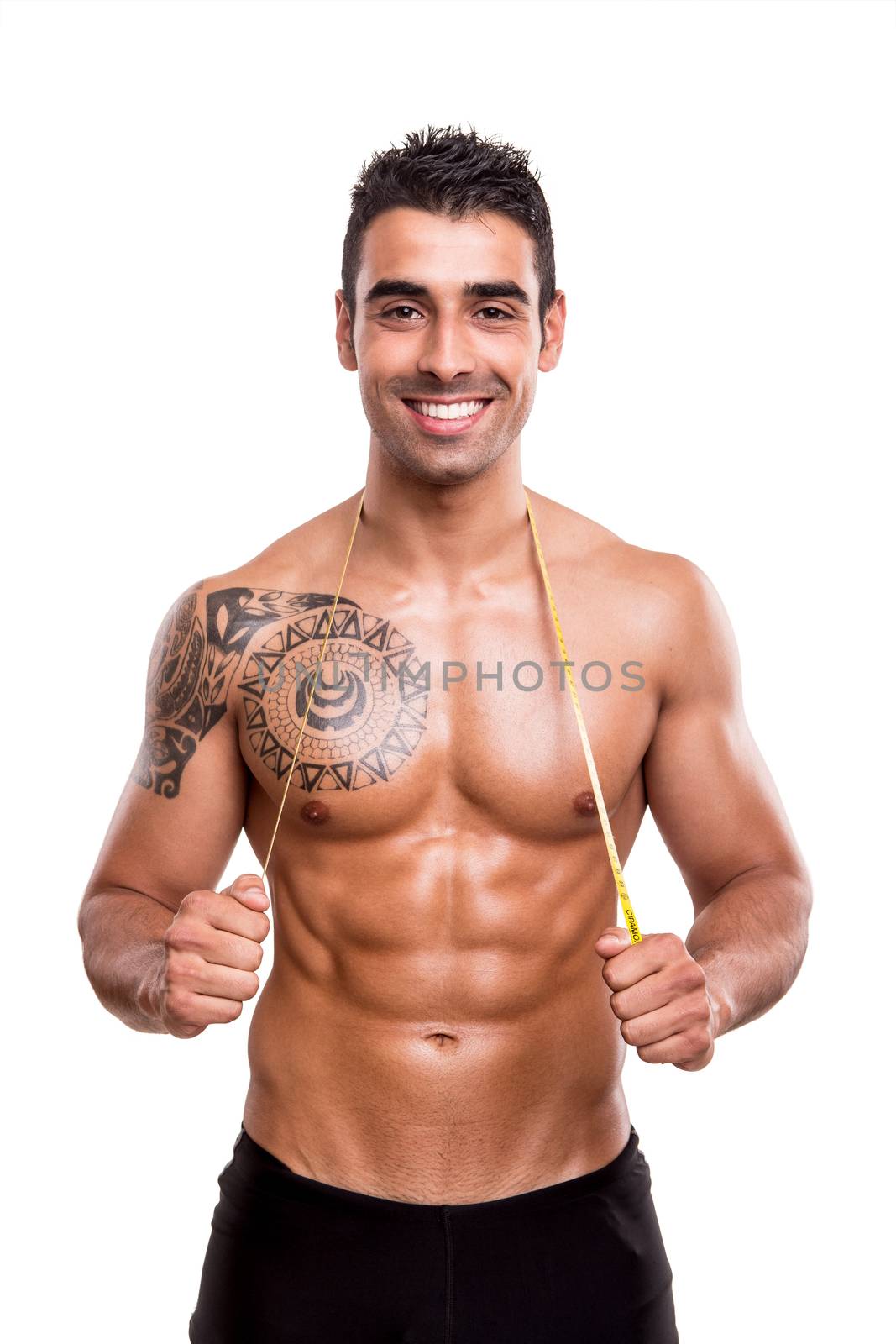 Fitness man measuring his body over white background