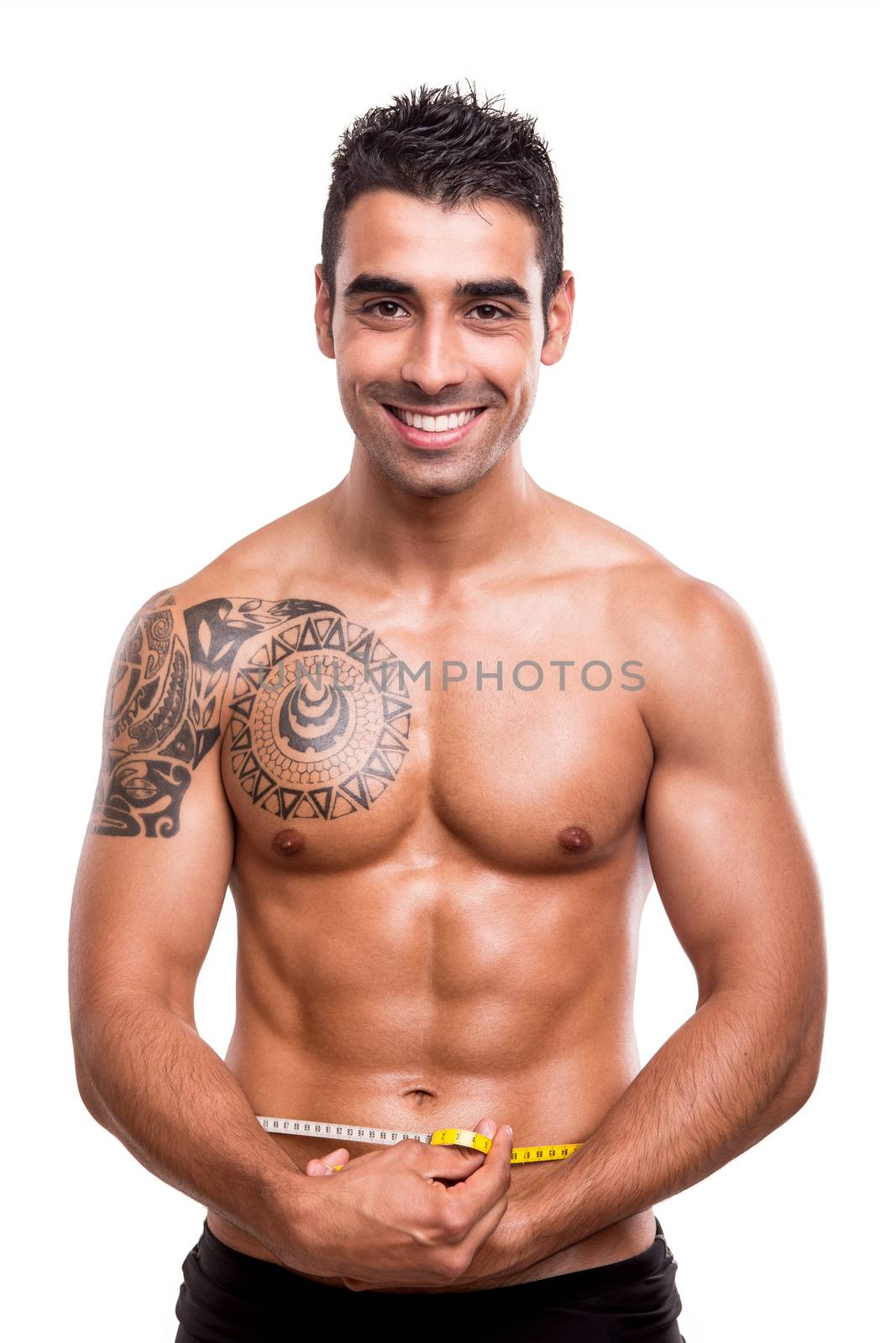 Fitness man measuring his body over white background