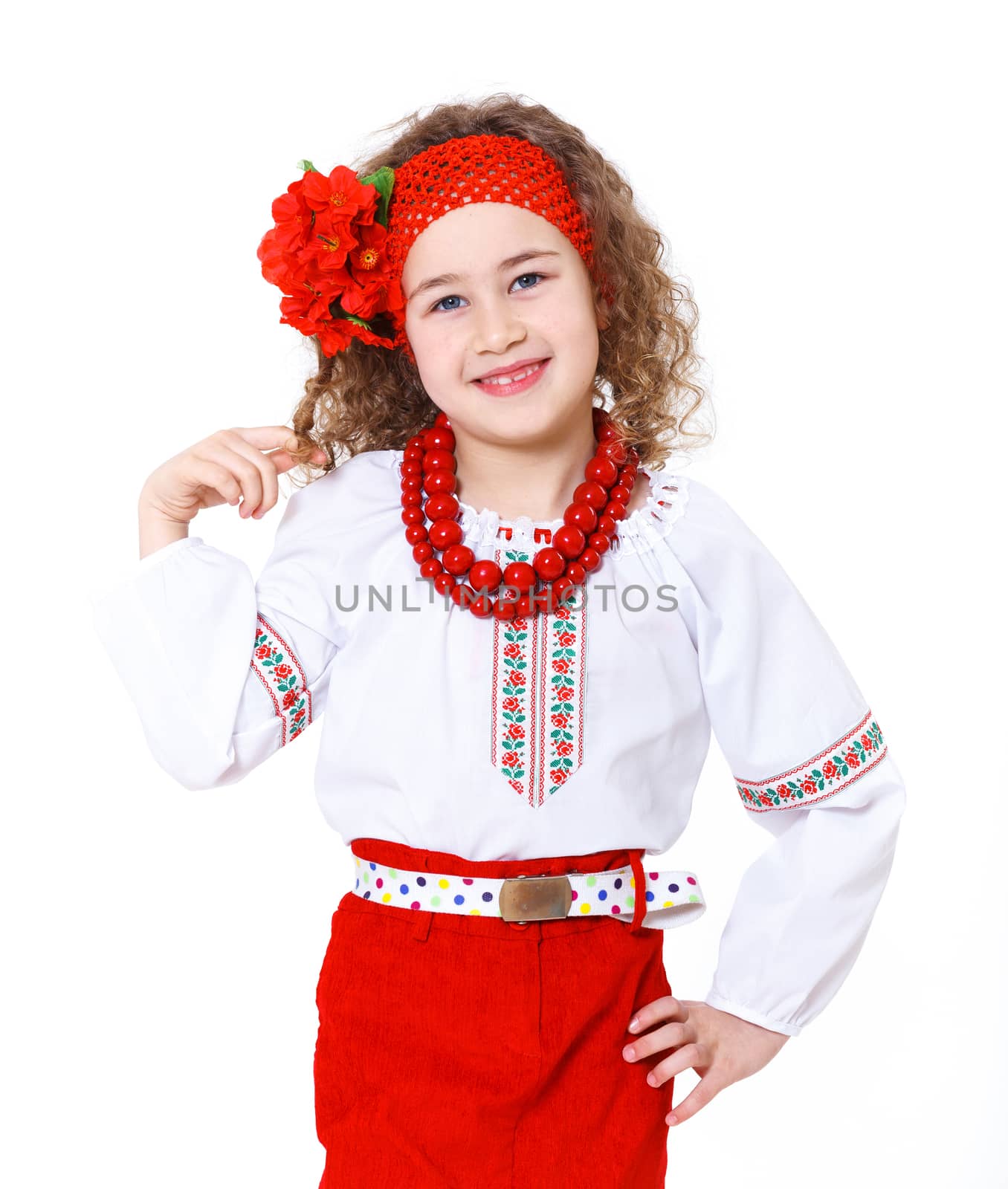 A little girl in Ukrainian national dress on the white background