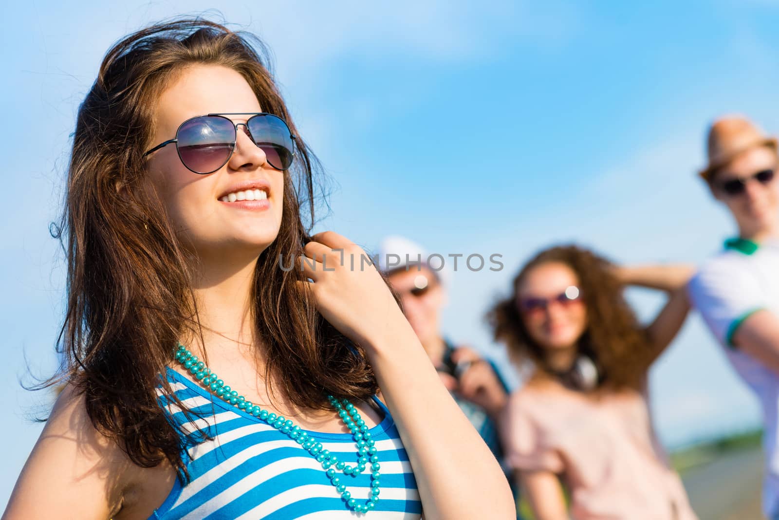 stylish young woman in sunglasses by adam121