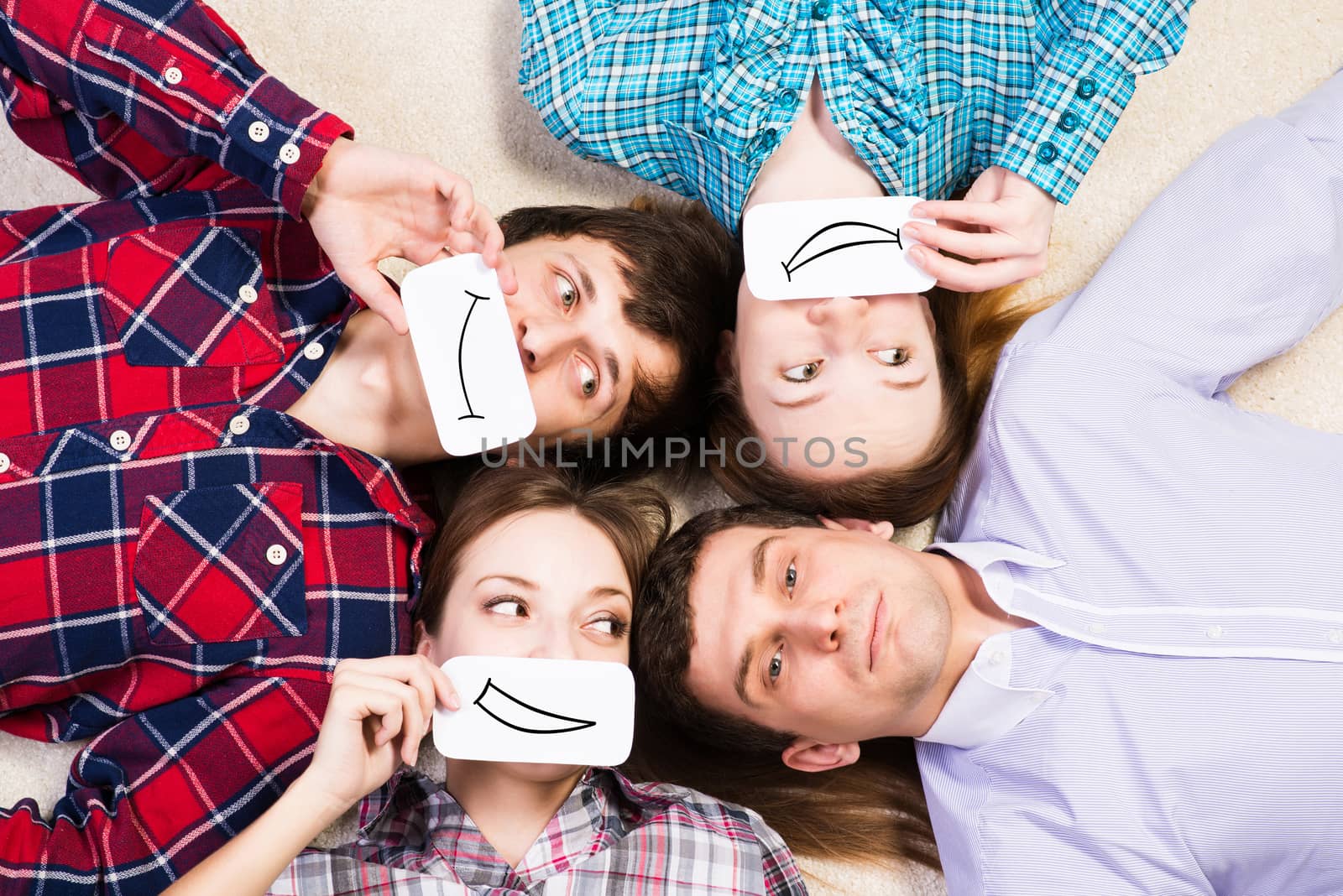 four young men lie together, applied to the face card with smiles