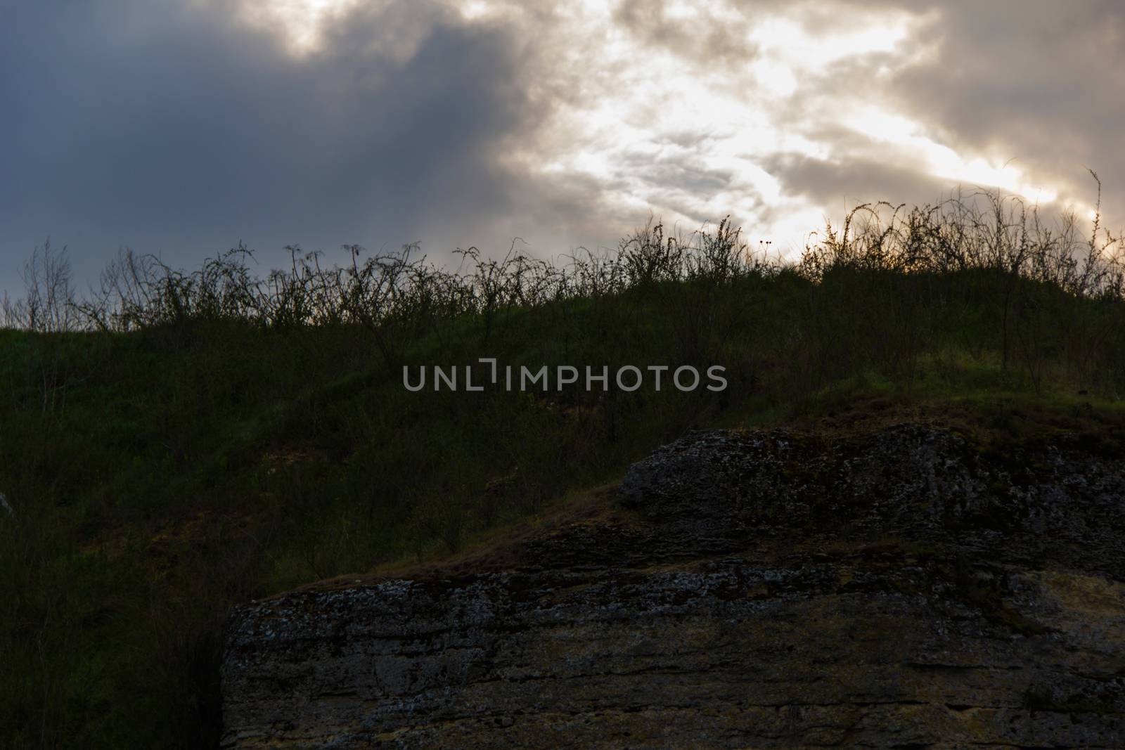   landscape  with sky, clouds, grass and stone