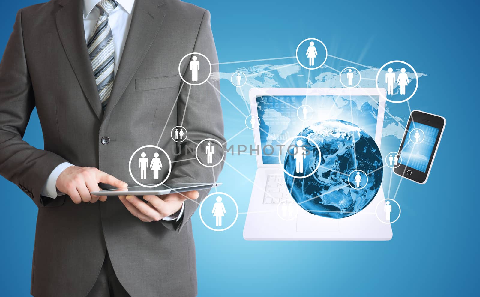 Businessman in suit holding tablet. Near the earth and electronics. Elements of this image are furnished by NASA