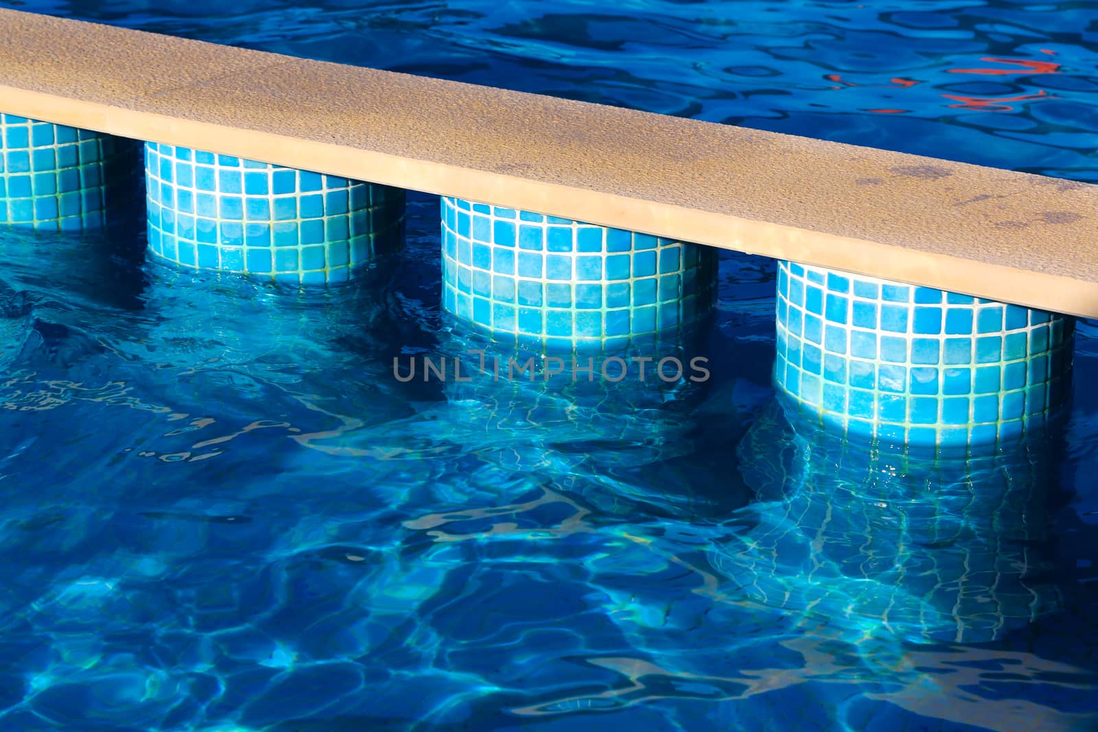 Stair Case in the swimming pool with blue water