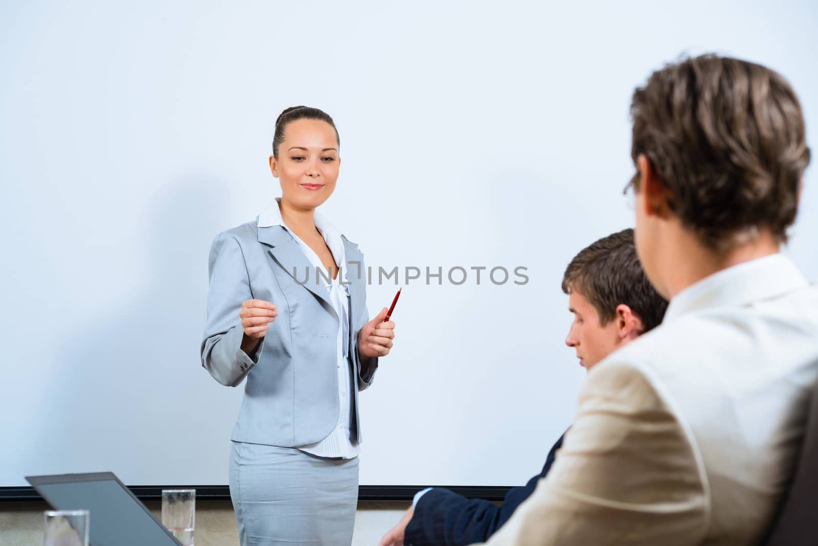 discusses business woman with colleagues by adam121