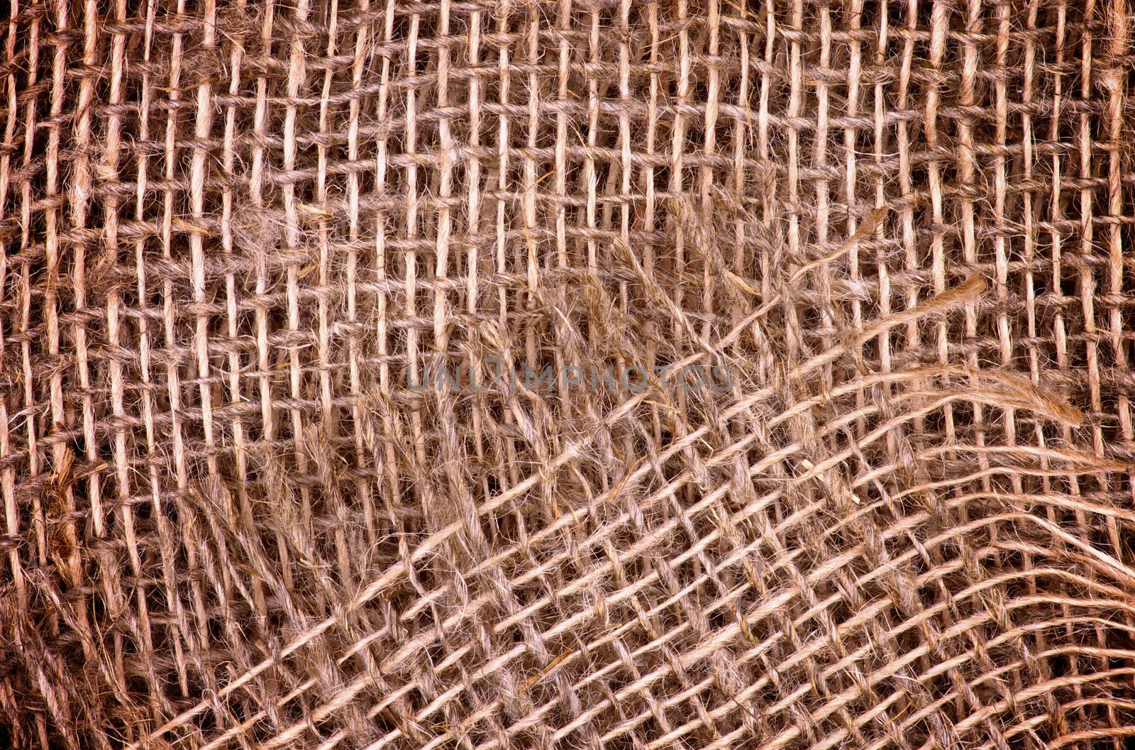 Background of Textured Brown and Beige Burlap Sack closeup