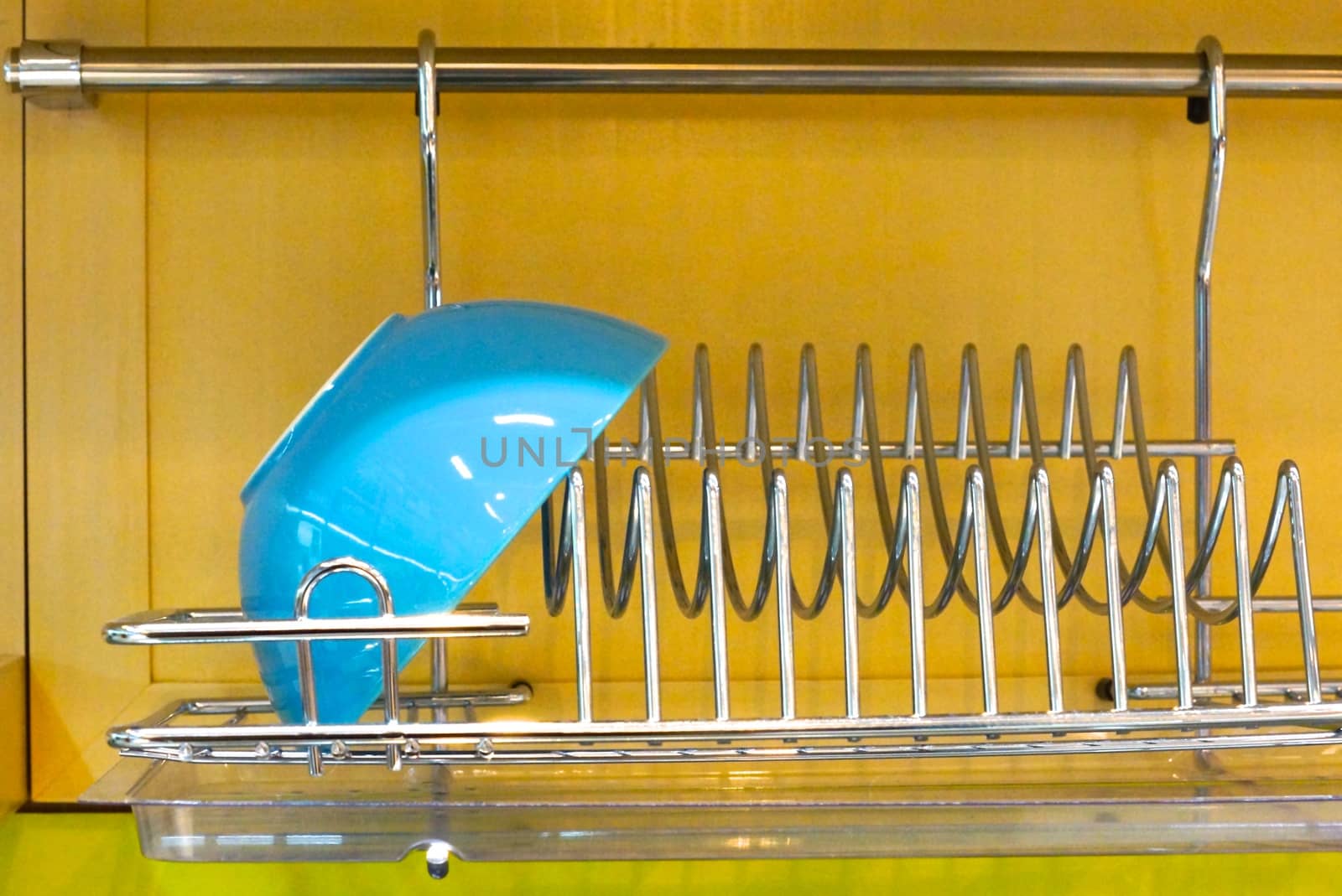 blue bowl on stainless shelf,shallow focus
