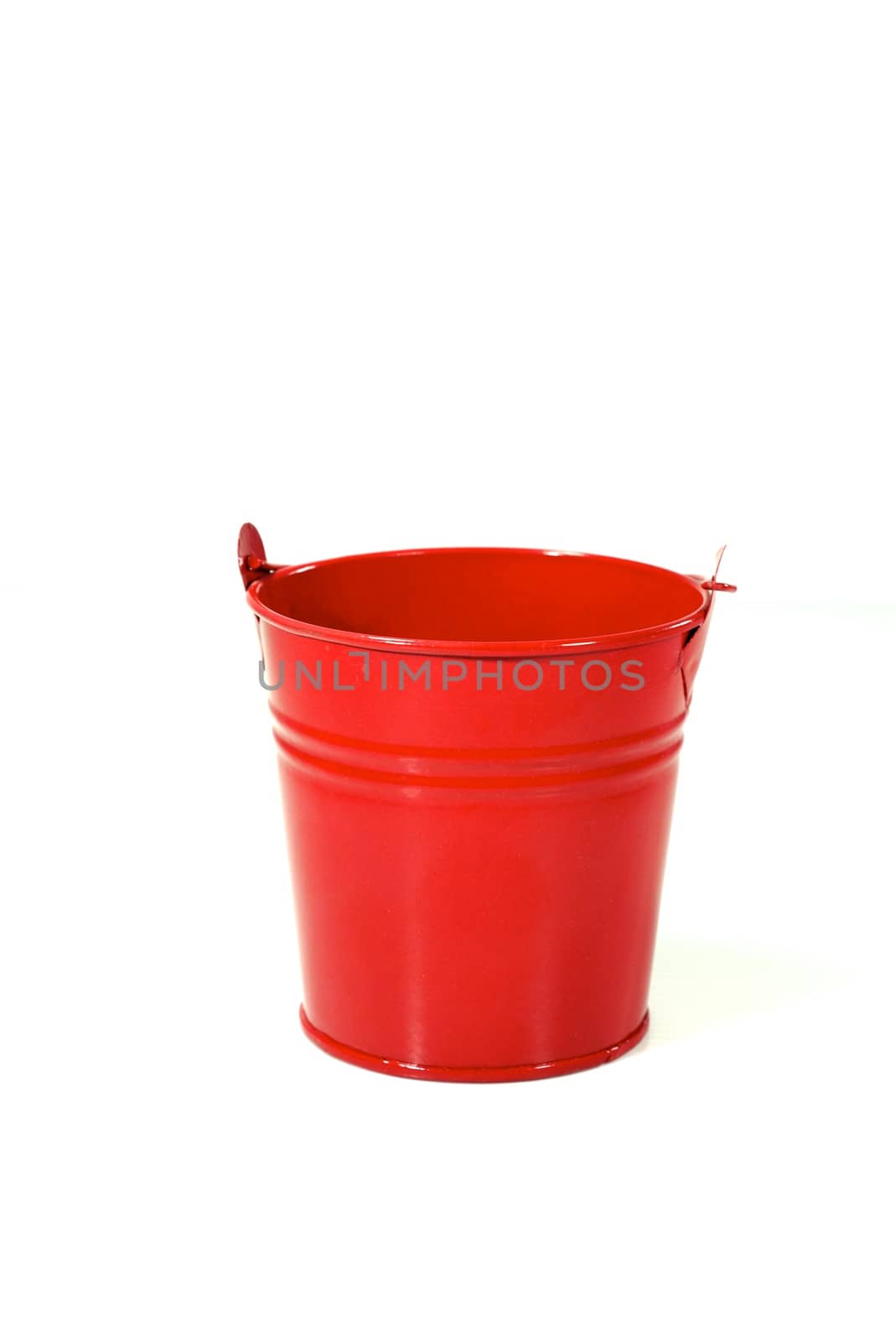 small red bucket on white scene,shallow focus