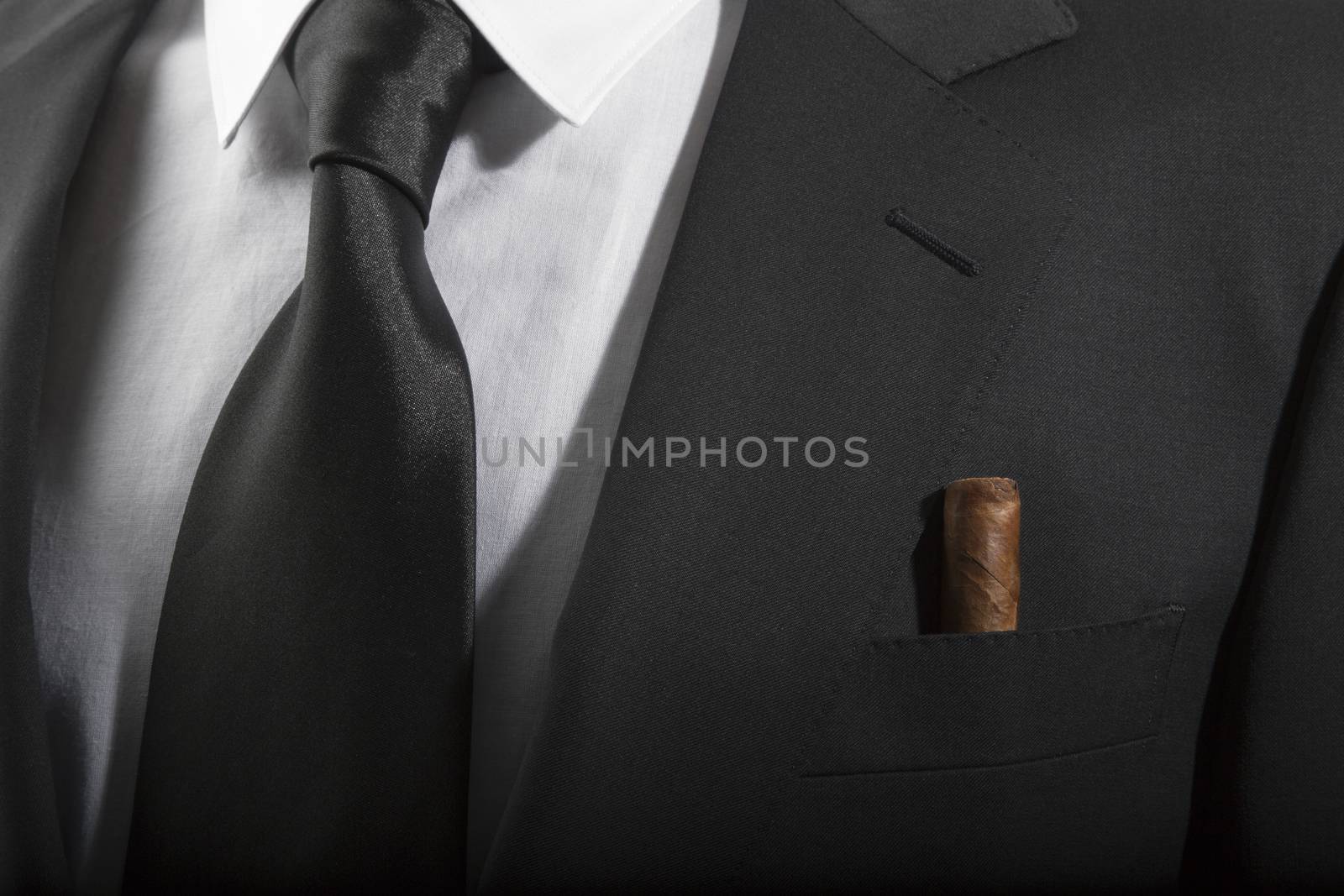 Jacket and tie with cuban cigar in the pocket, Italian fashion concept