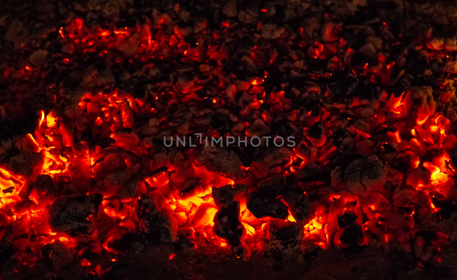Abstract background of glowing coals in fireplace