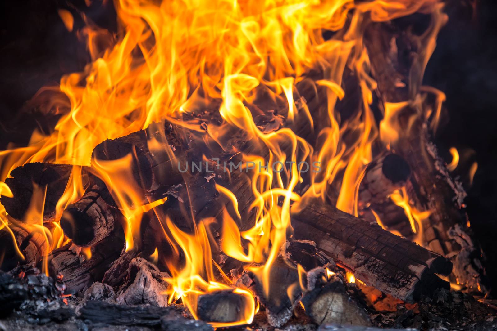 Flames of bonfire in fireplace