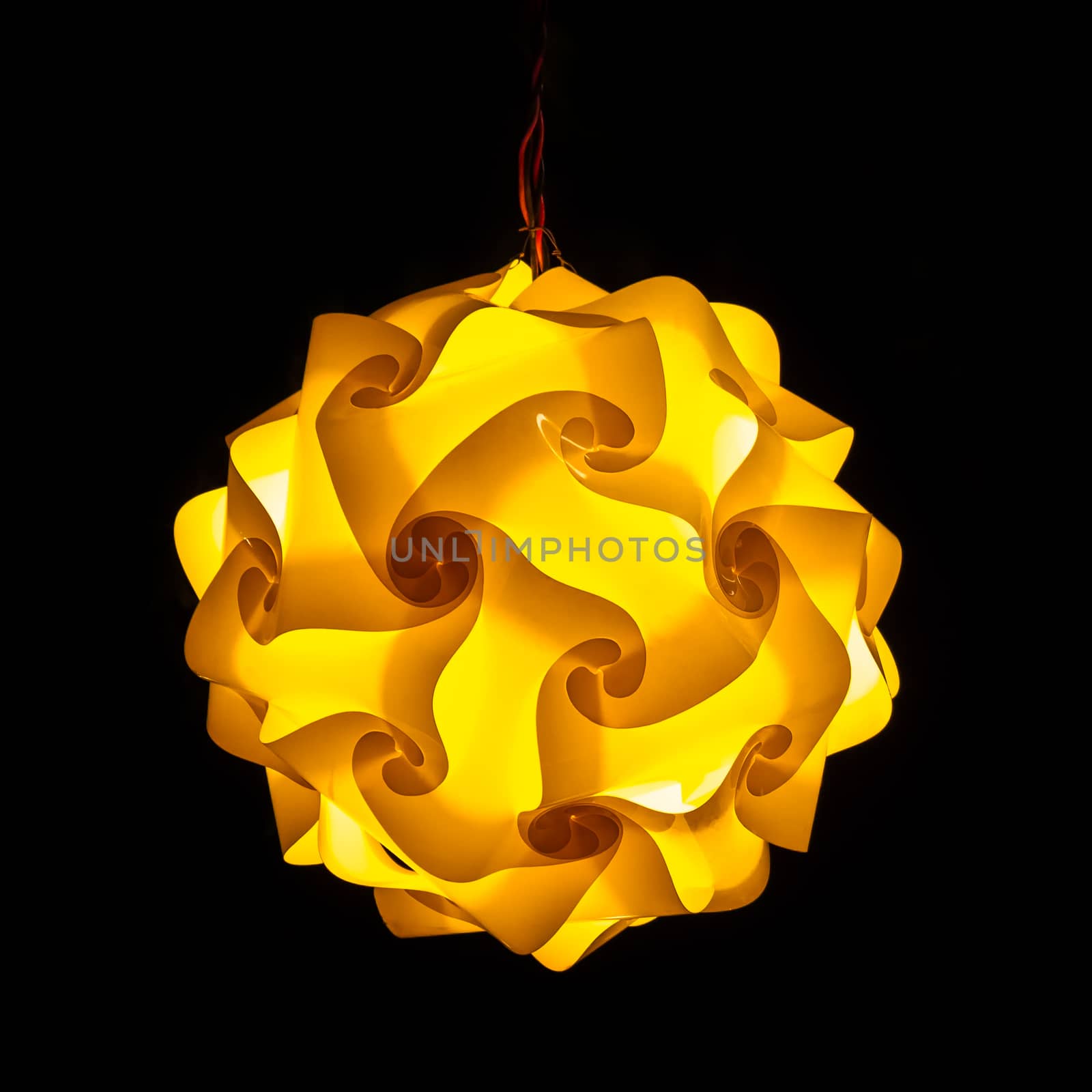 Yellow street lamp on black background
