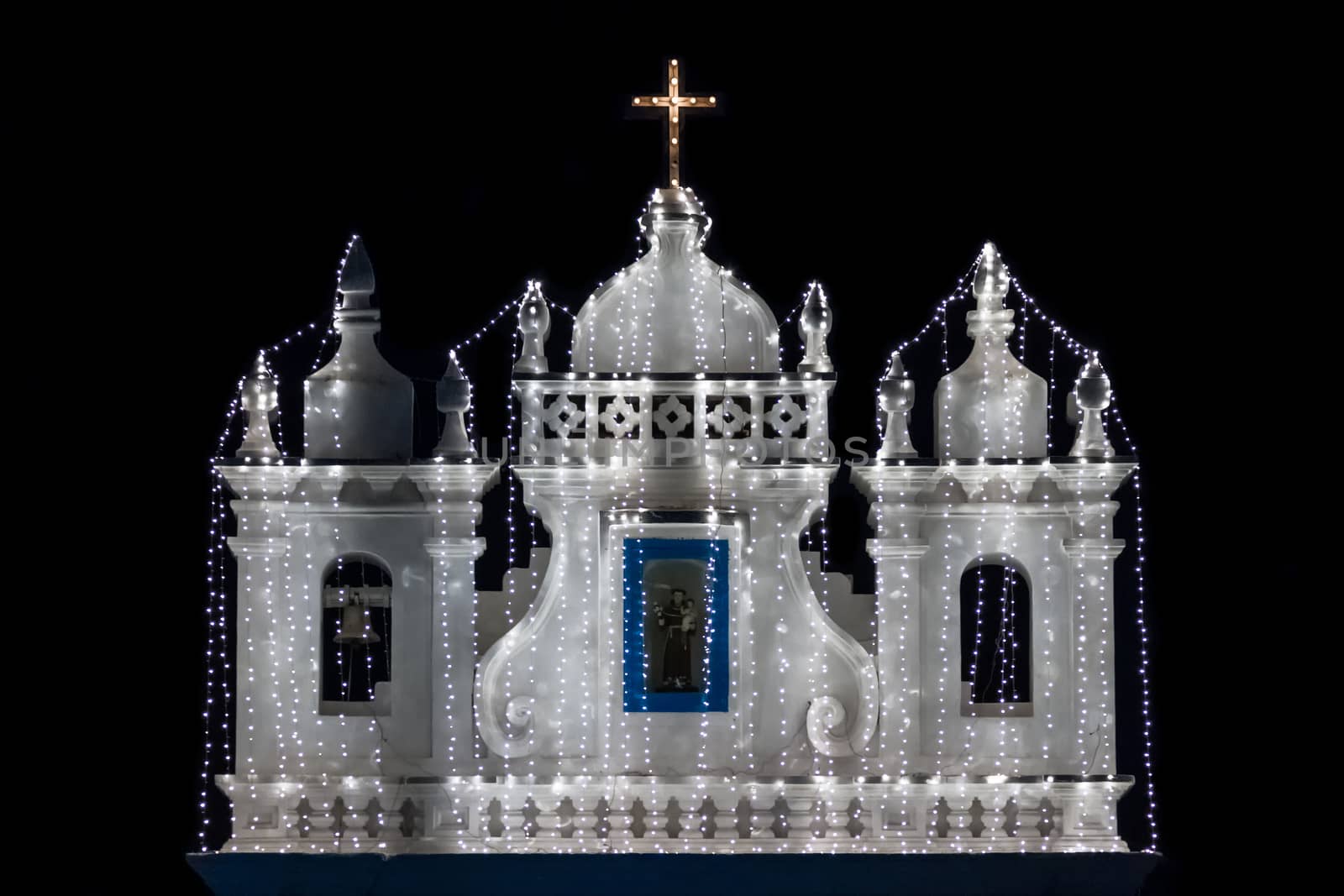 Illuminated church at the night on black background