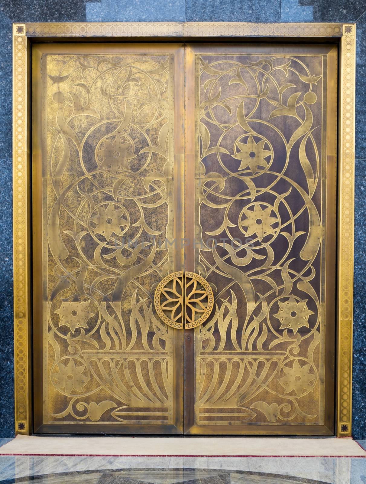 Door of mosque decorated with gold in Dubai.