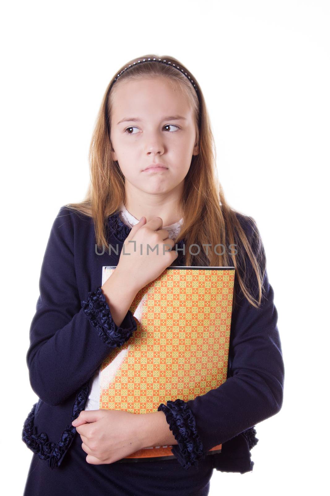 Upset schoolgirl in uniform and books looking aside isolated on white