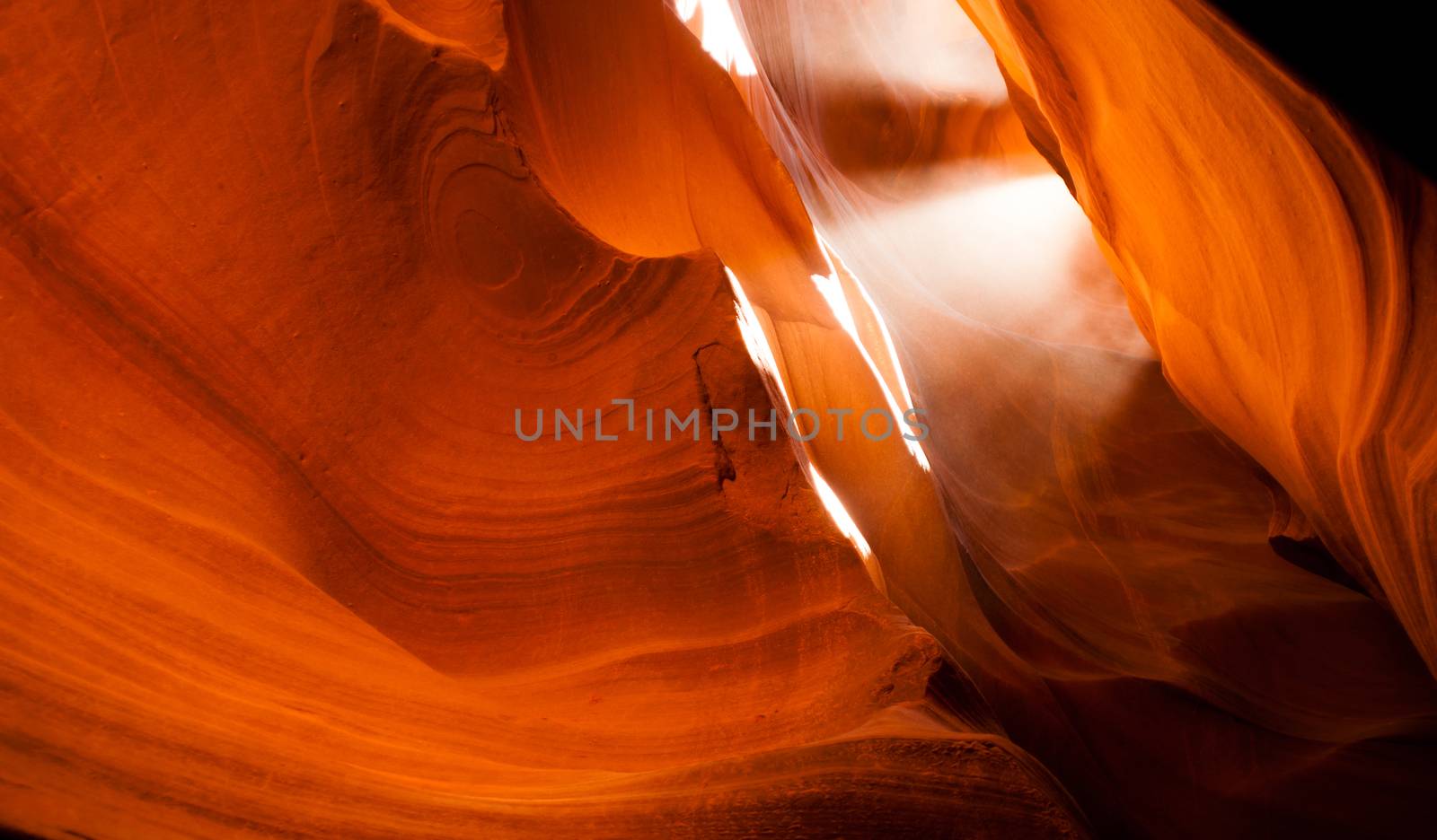 Sunlight Beams Through Crevass Sandstone Rock Antelope Slot Canyon