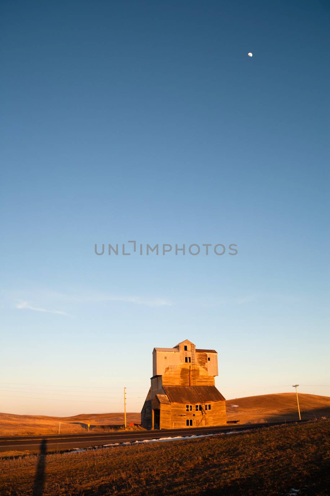 An Old Agricultural Structure Still Stands while the sun sets