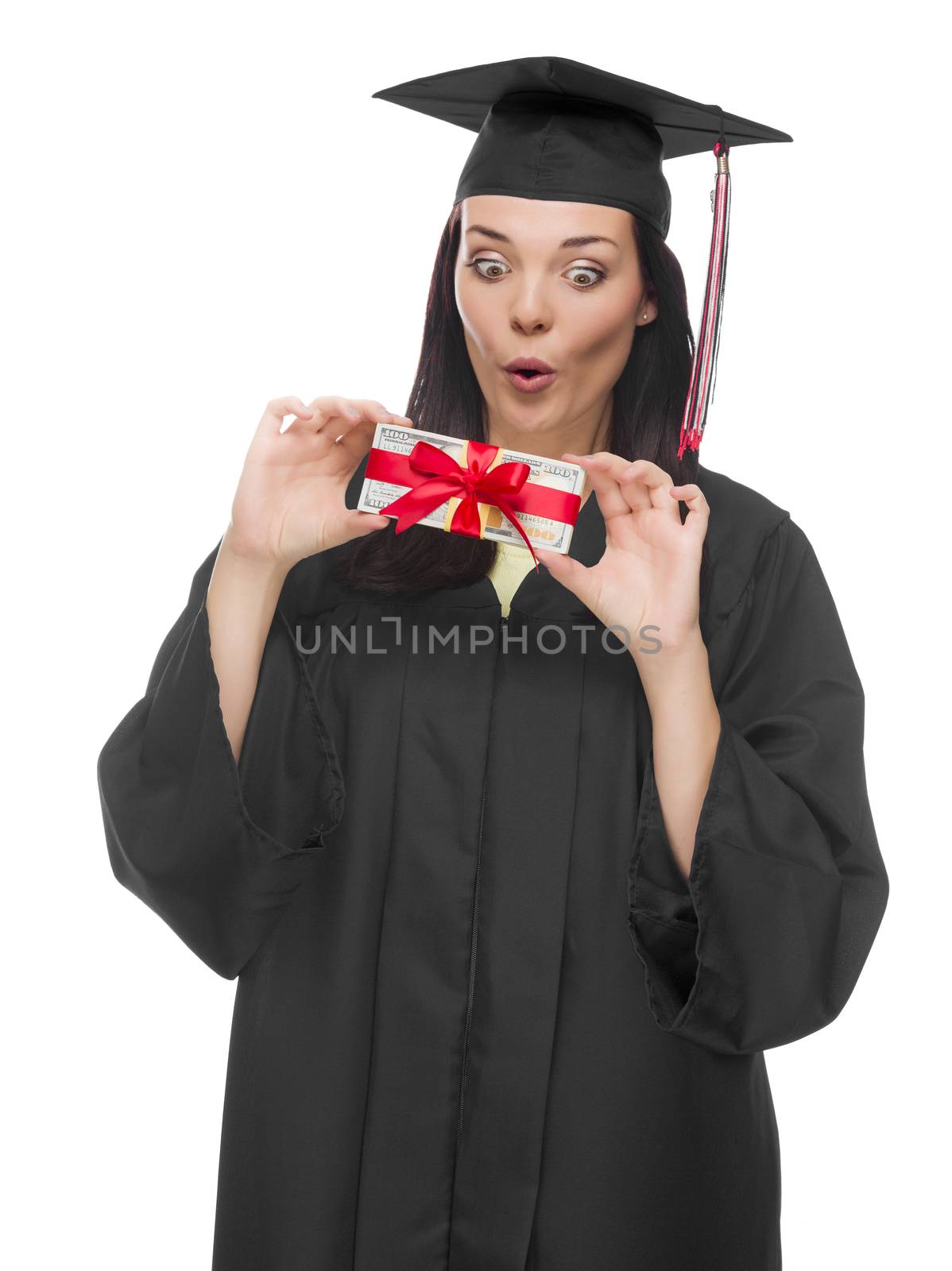 Happy Female Graduate in Cap and Gown Holding Stack of Gift Wrapped Hundred Dollar Bills Isolated on a White Background.