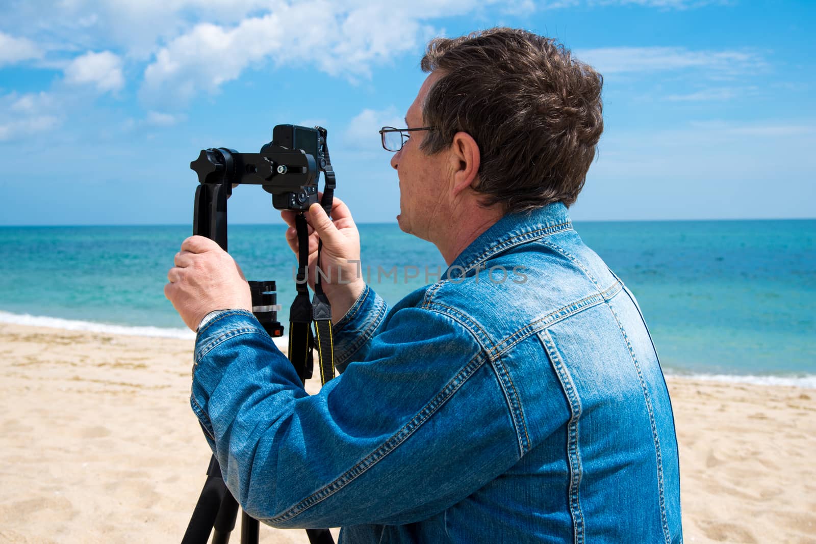 photographer takes pictures panorama of the sea seaside