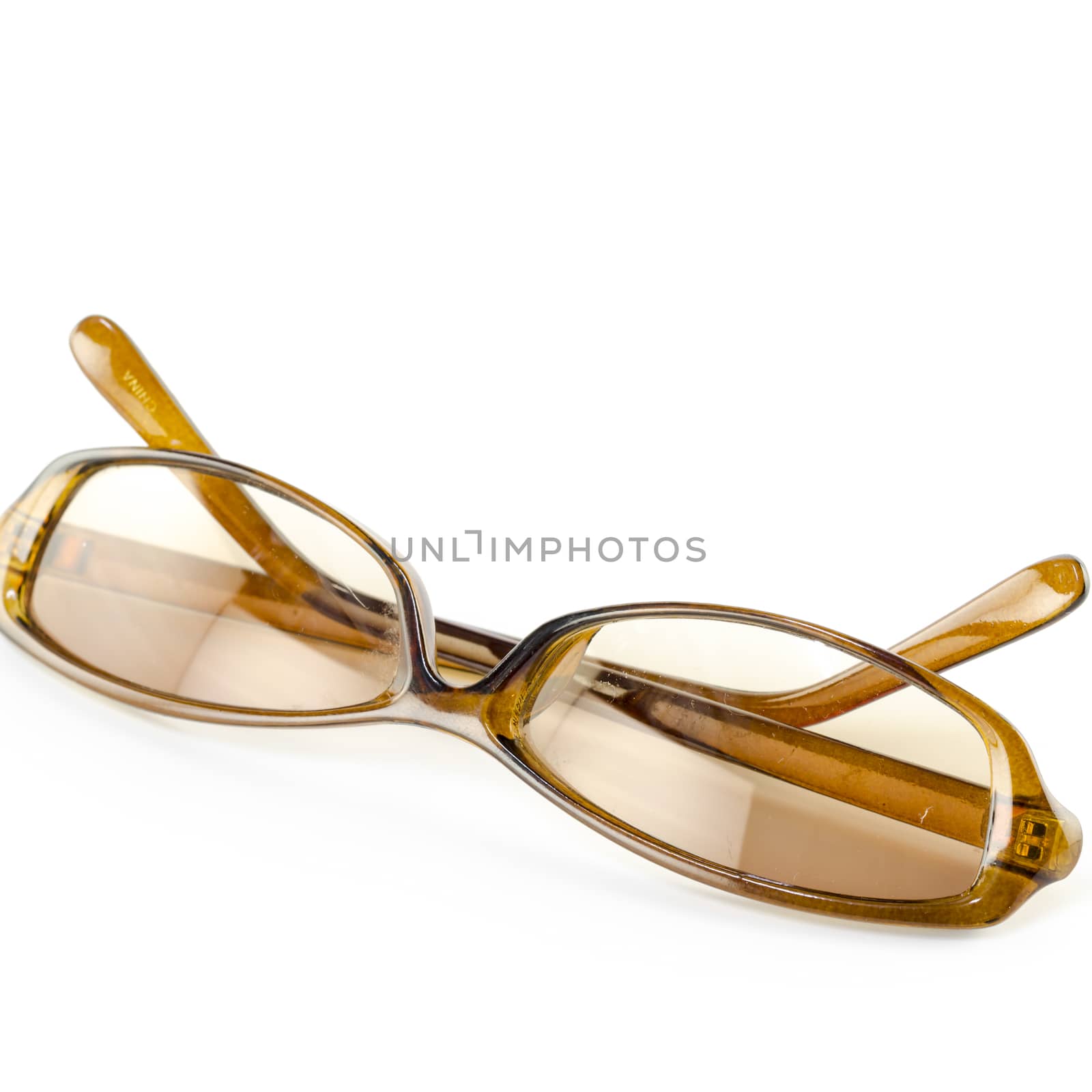 brown sunglasses isolated on white by ammza12