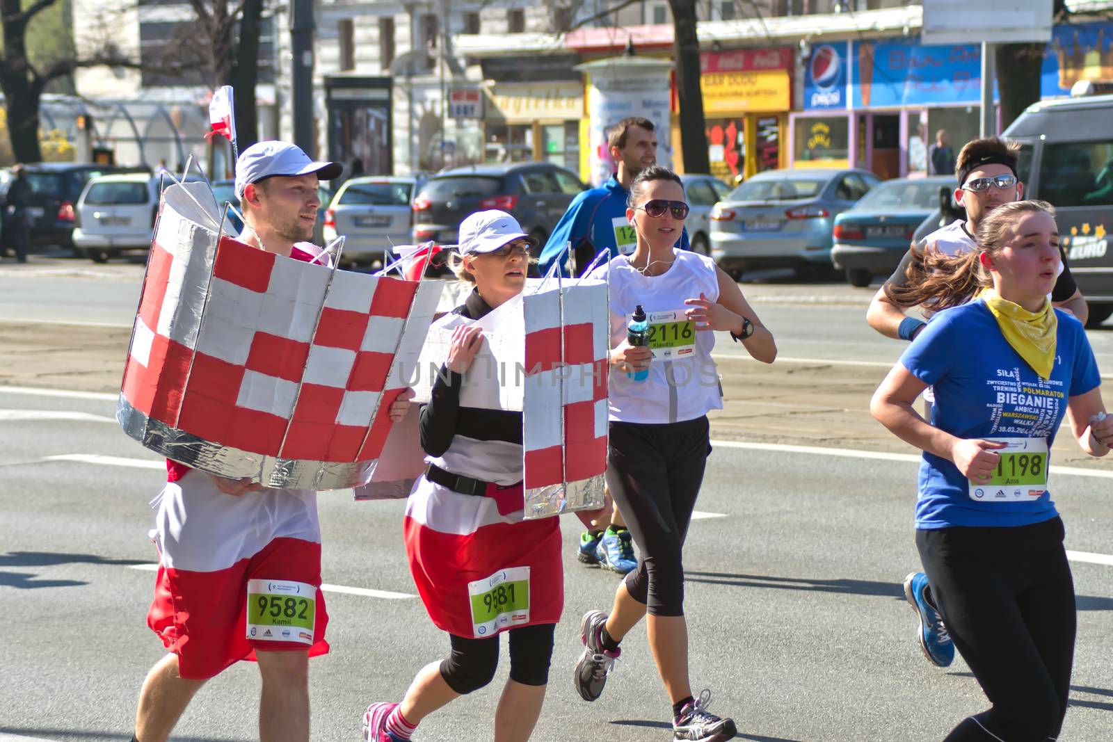 Warsaw, Poland – March  30, 2014: 9th Warsaw Half Marathon. Runners in hilarious and funny costumes