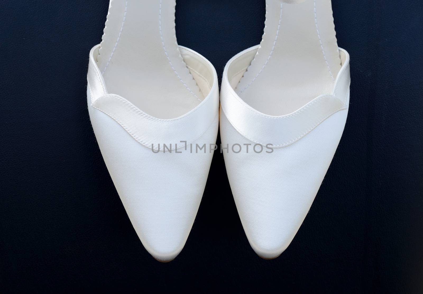Brides shoes closeup by kmwphotography