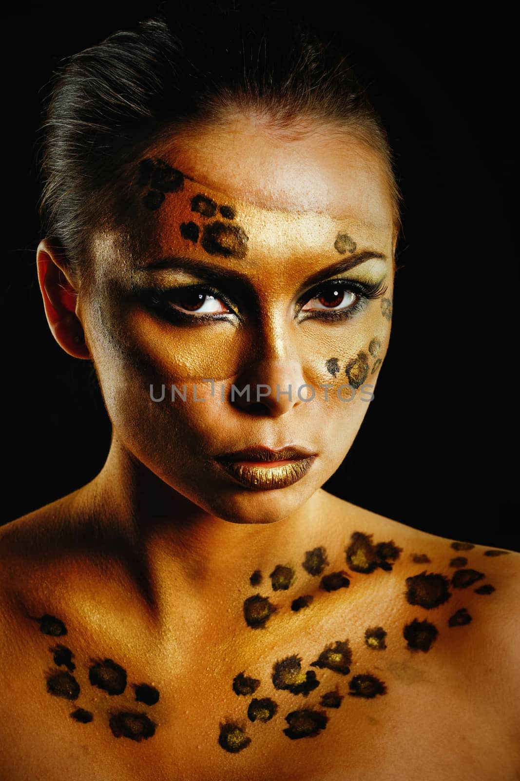 Attractive young girl with makeup wild leopard close-up portrait