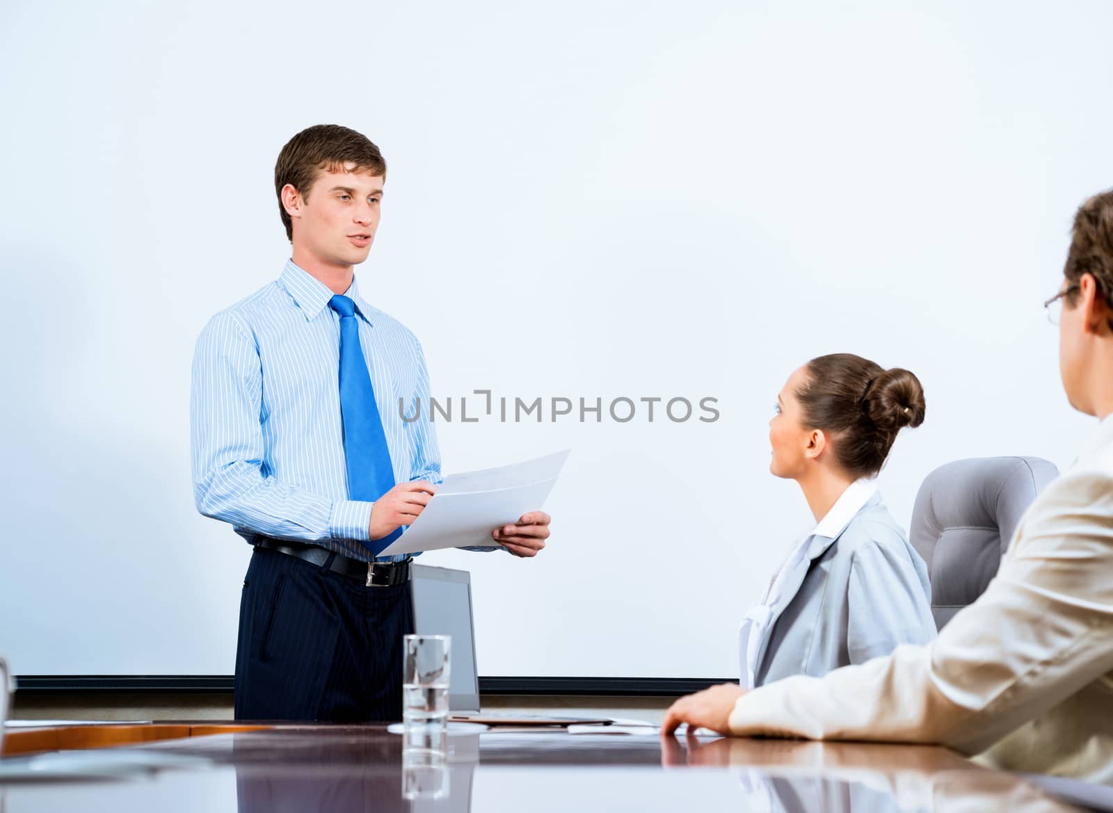image of a businessman talking to colleagues, teamwork in the office