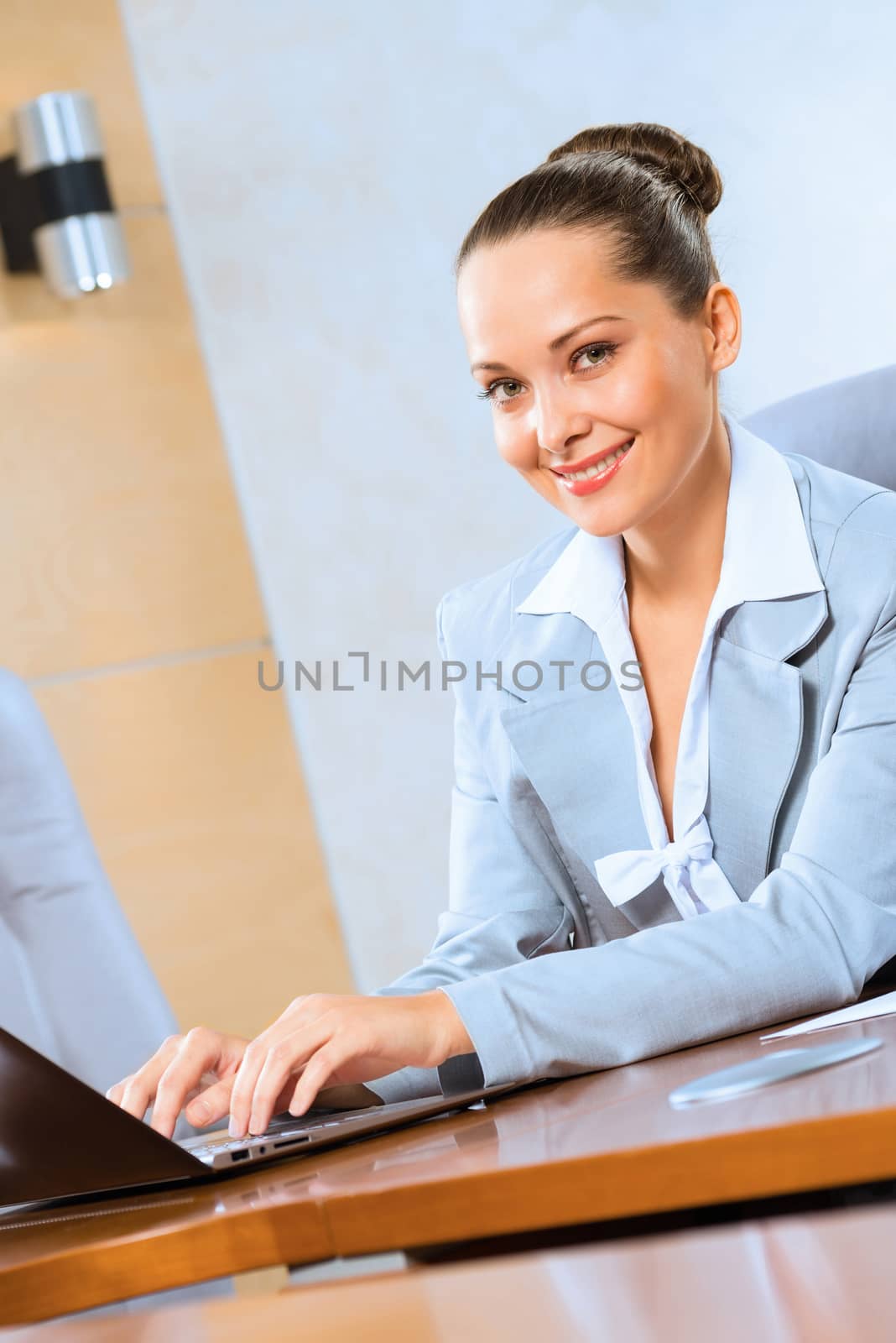 image of a successful business woman, working with laptop