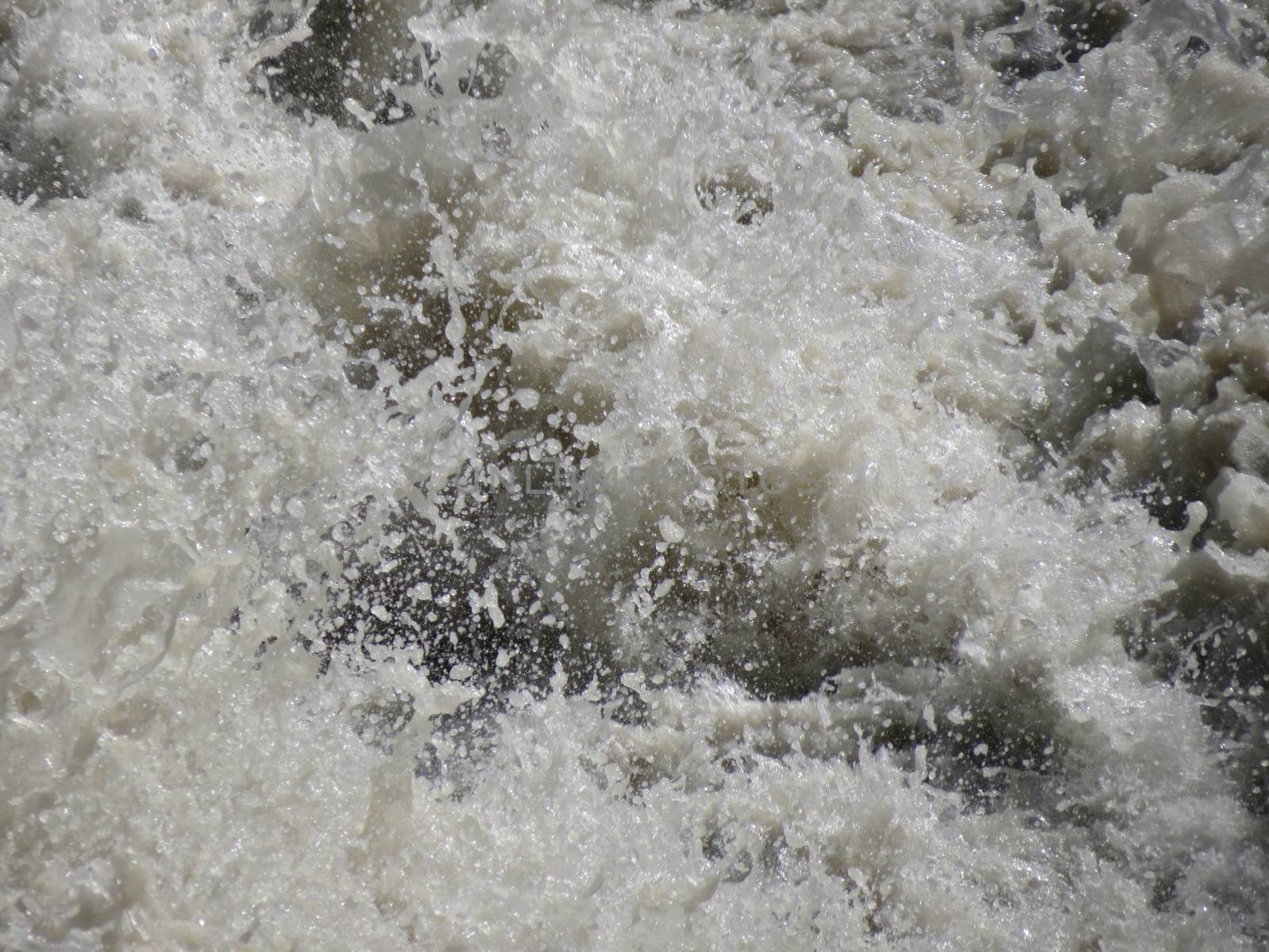troubled water in a river - detail