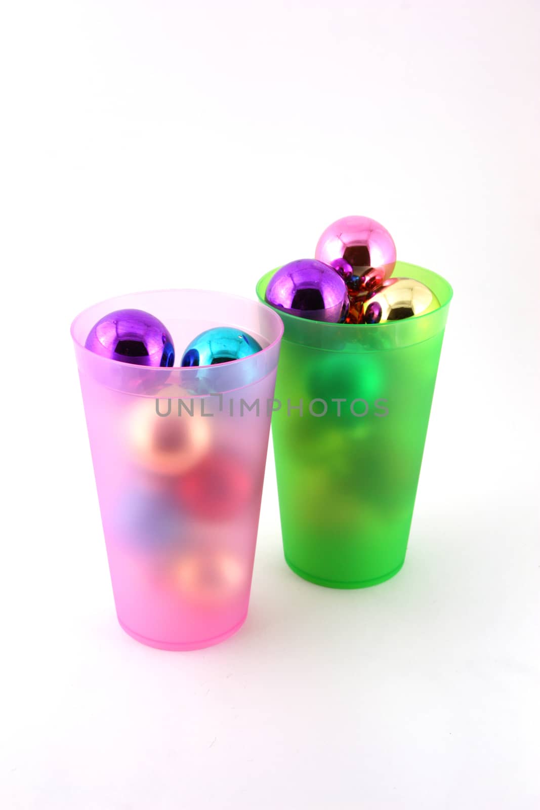 Color christmas decorations (balls) in cups