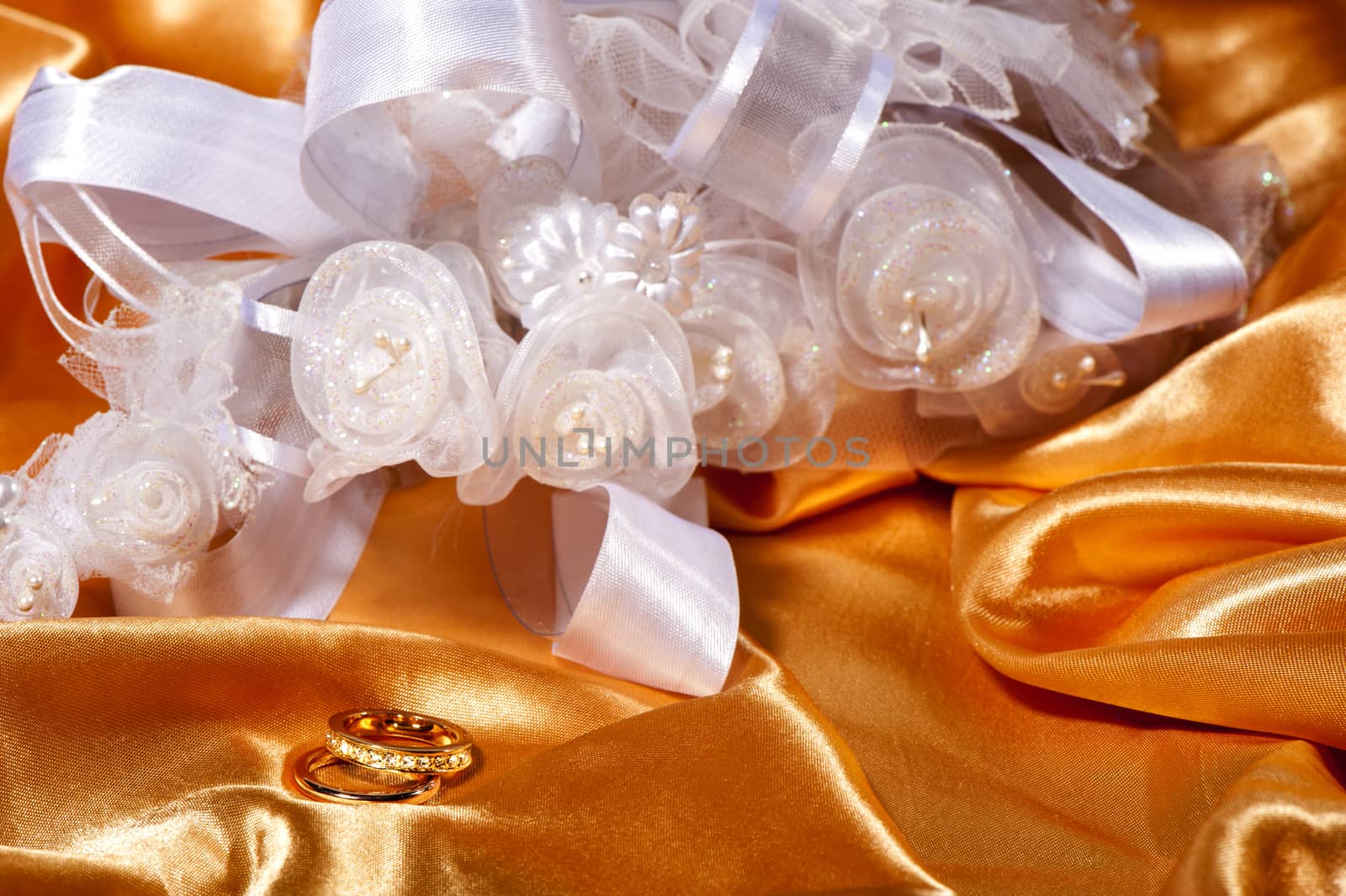 wedding rings on colorful fabric