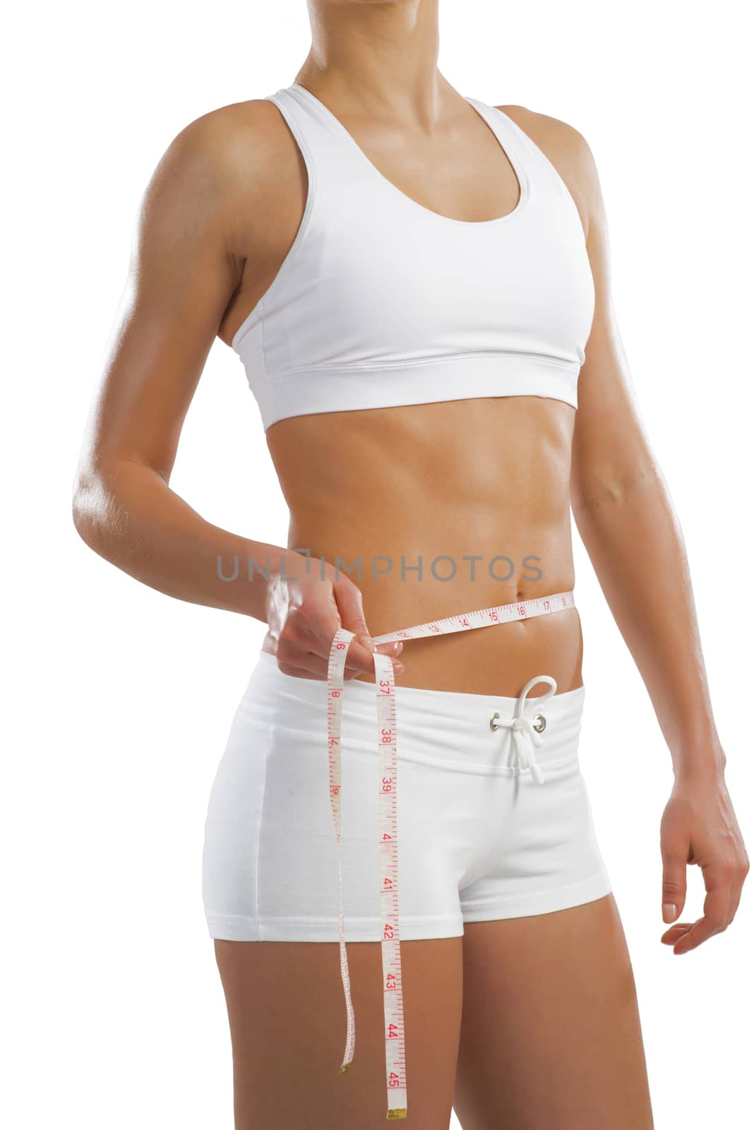 young athletic woman measuring waist by adam121