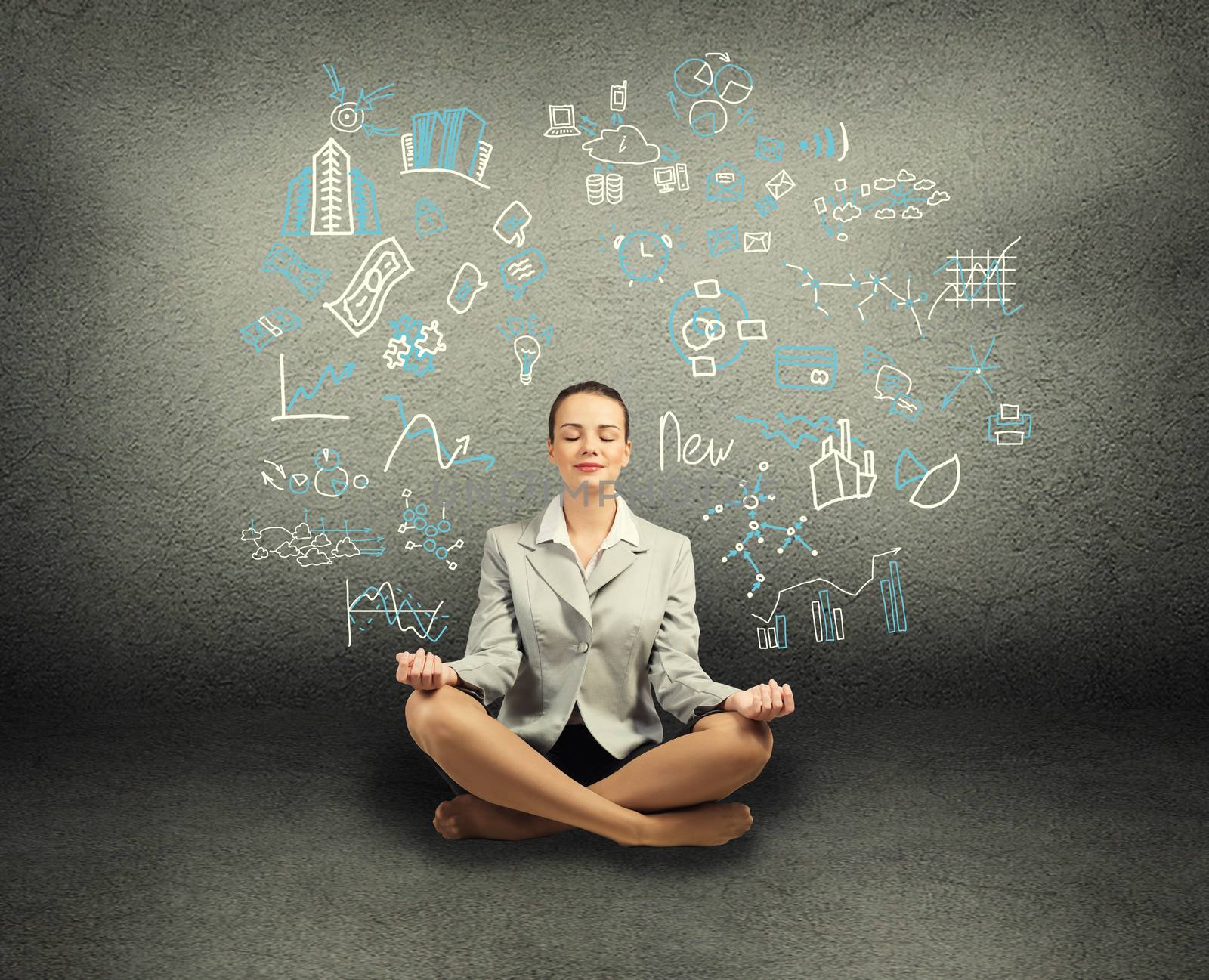 business woman meditating on floor by adam121