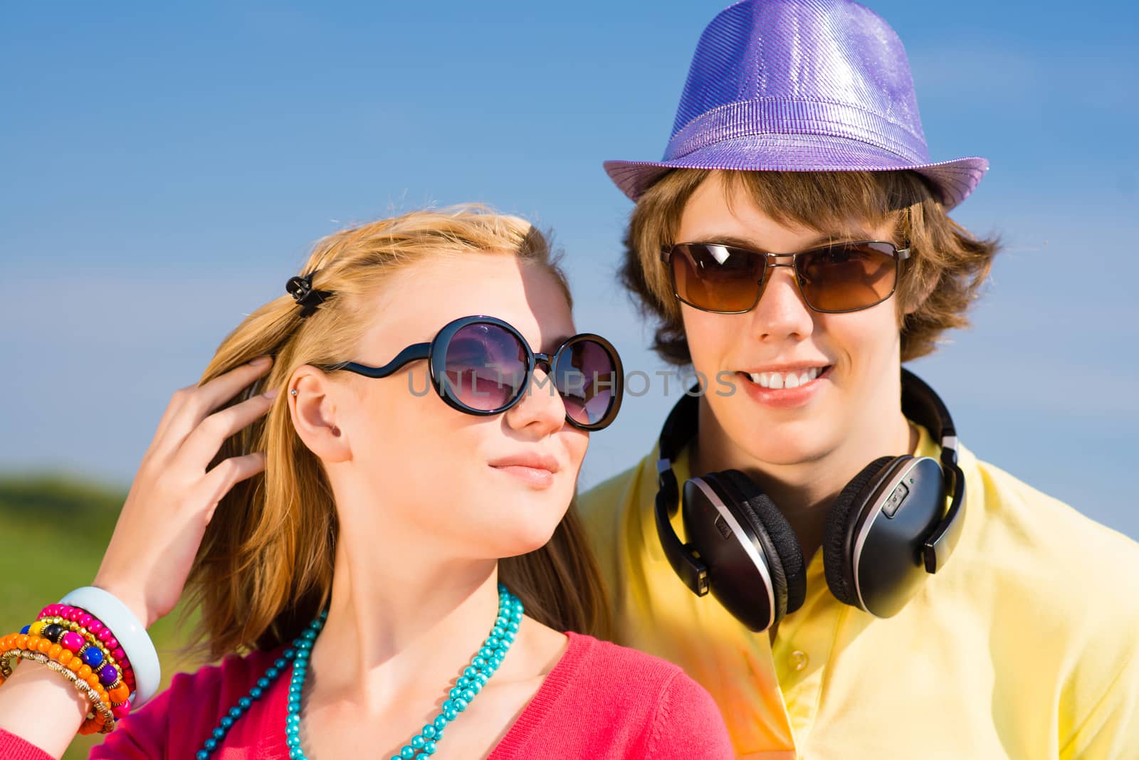 young couple standing on the road, having fun with friends