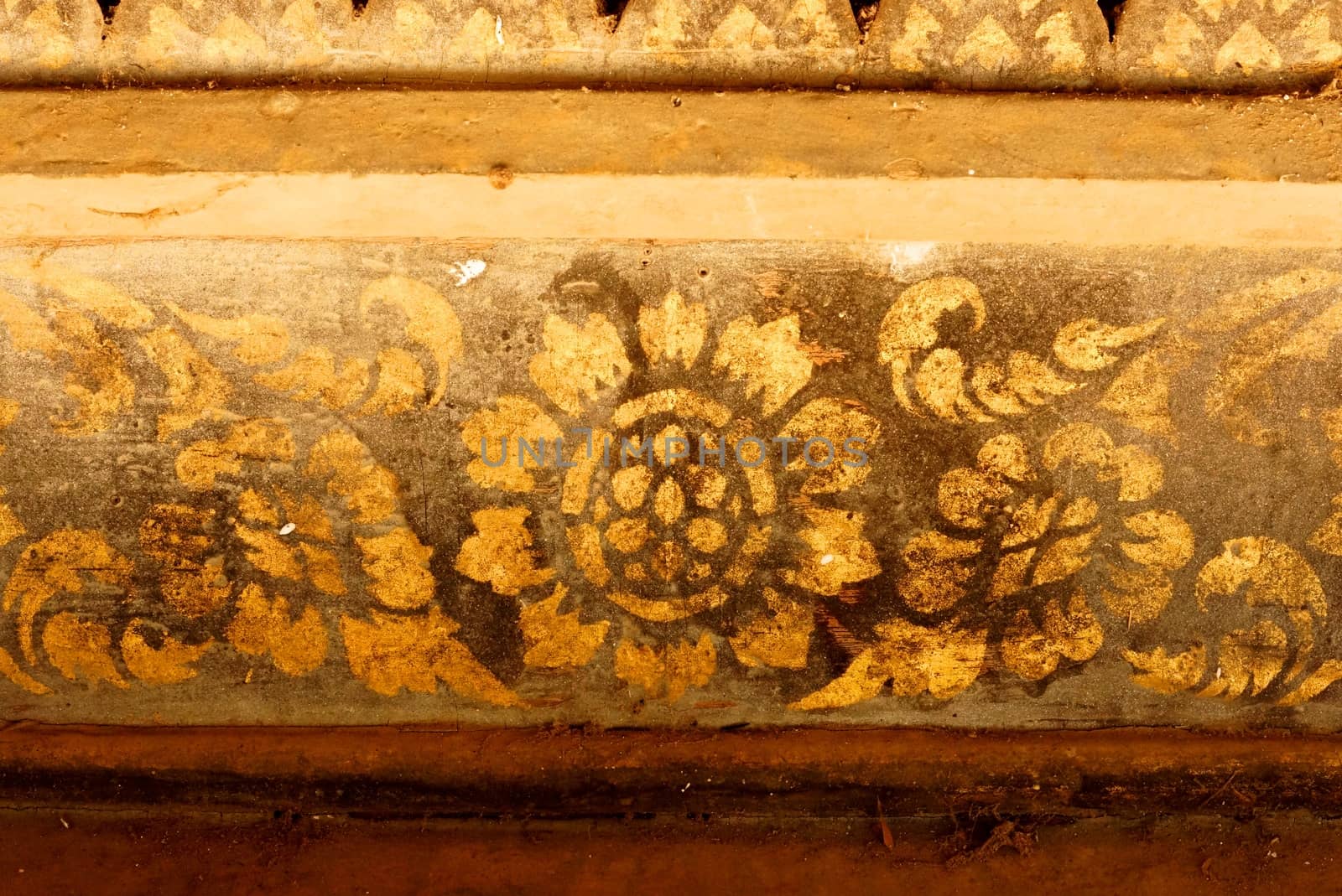 the detail of  thai gold painting pattern on ancient  wood plate,shallow focus,Lampang temple,Thailand