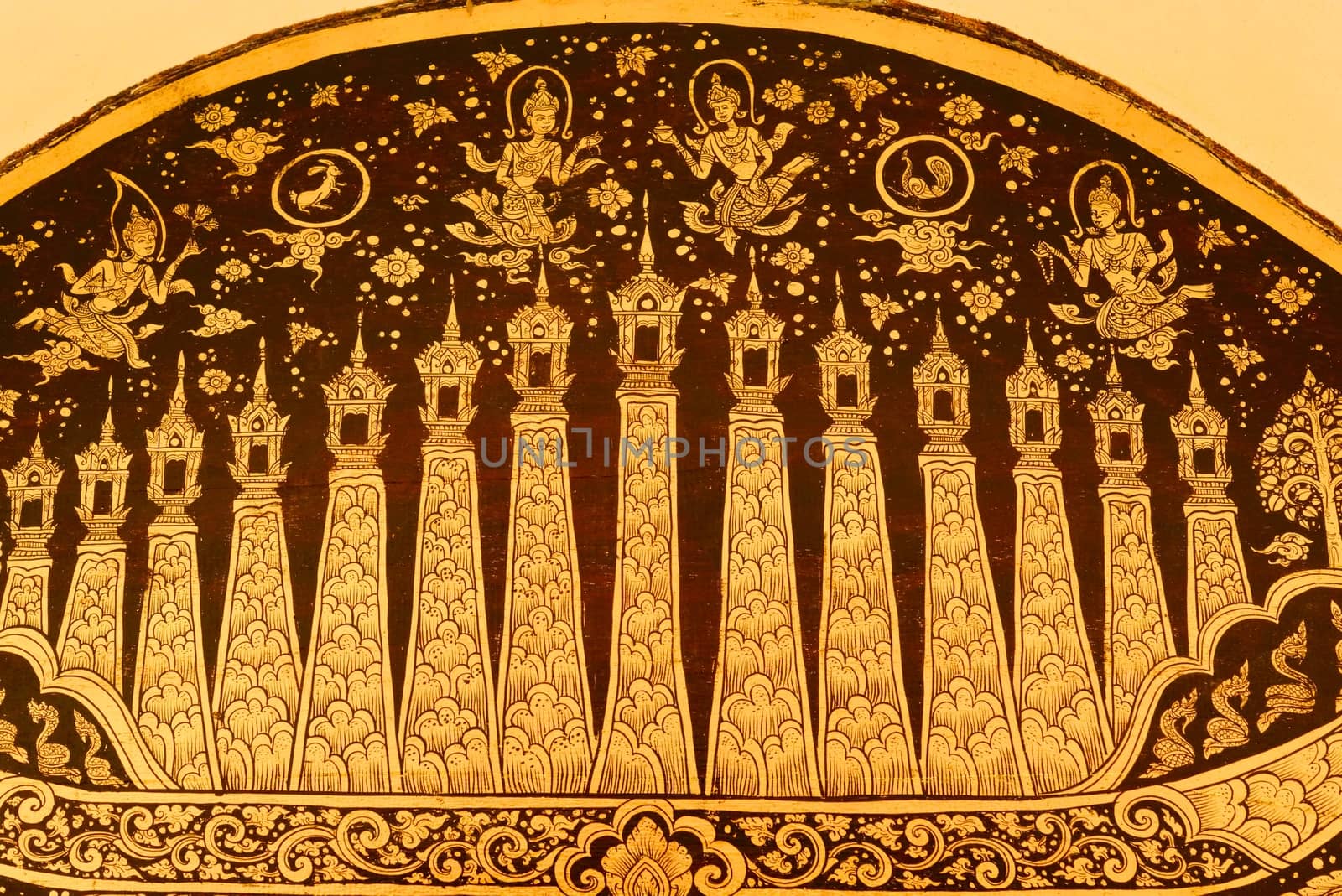 the detail of  thai gold painting pattern on ancient  wood plate,shallow focus,Lampang temple,Thailand