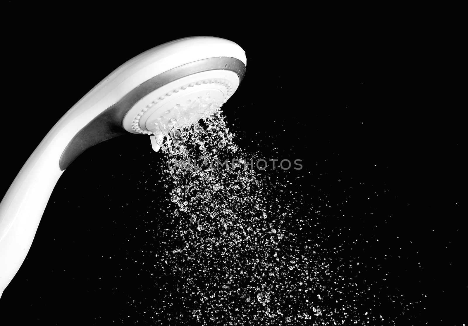 Modern shower head with running water isolated on black background