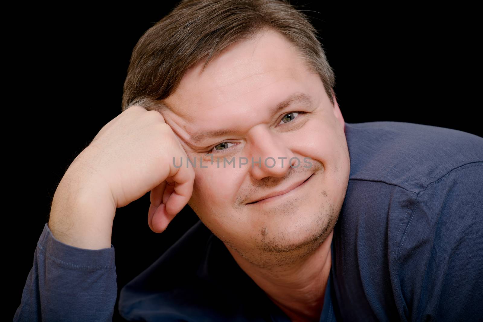 Mature man portrait on black background