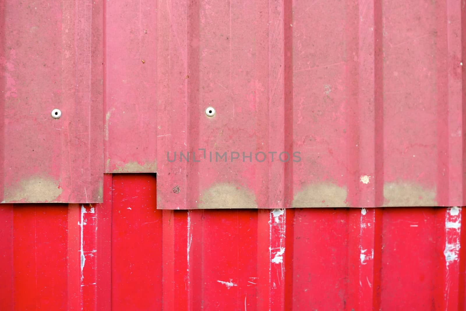 detail of red metal plate shallow focus