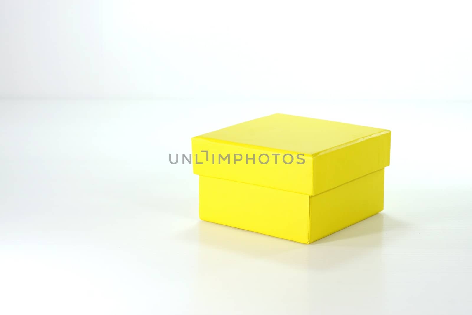 yellow paper box on white scene,shallow focus