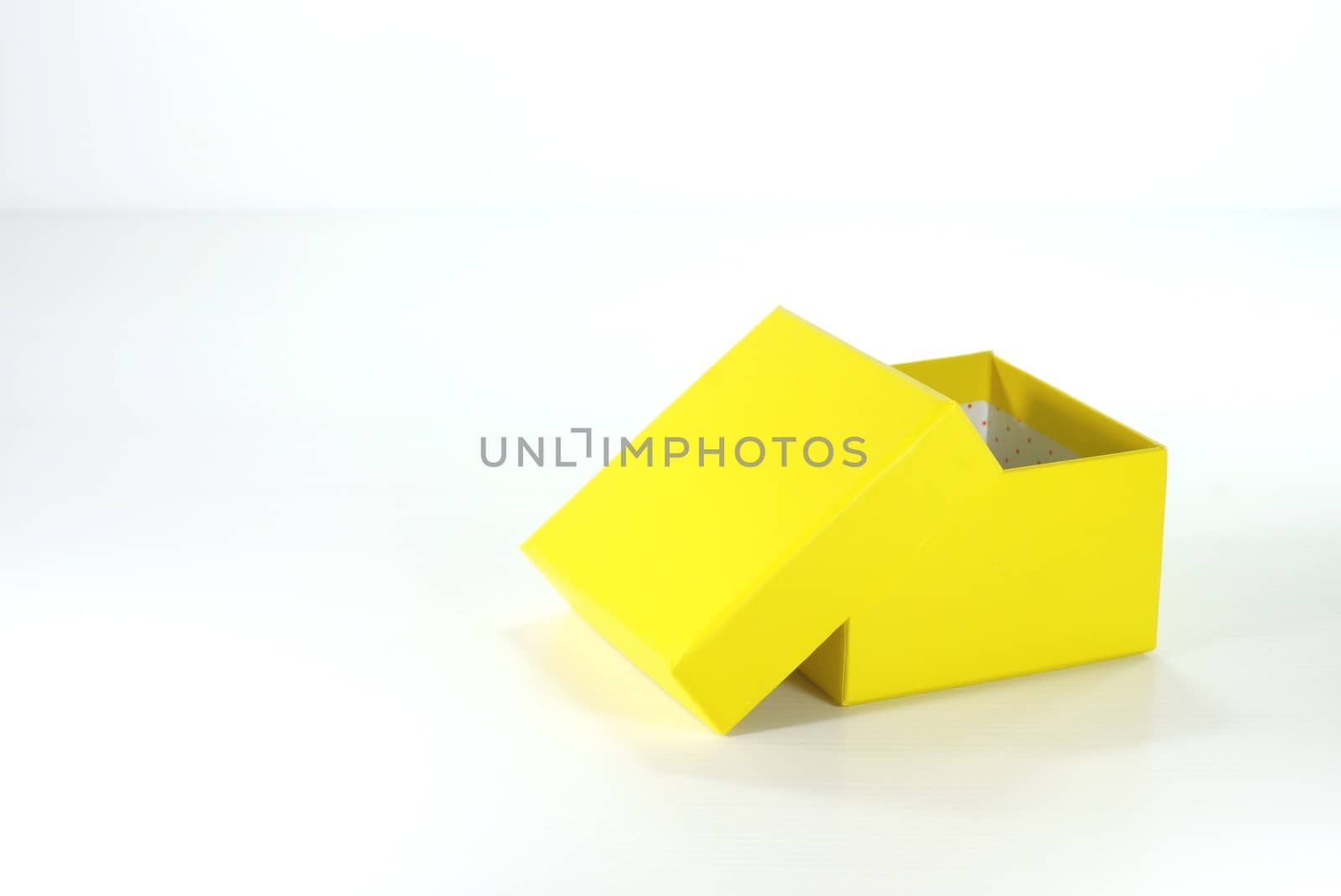 yellow paper box on white scene,shallow focus