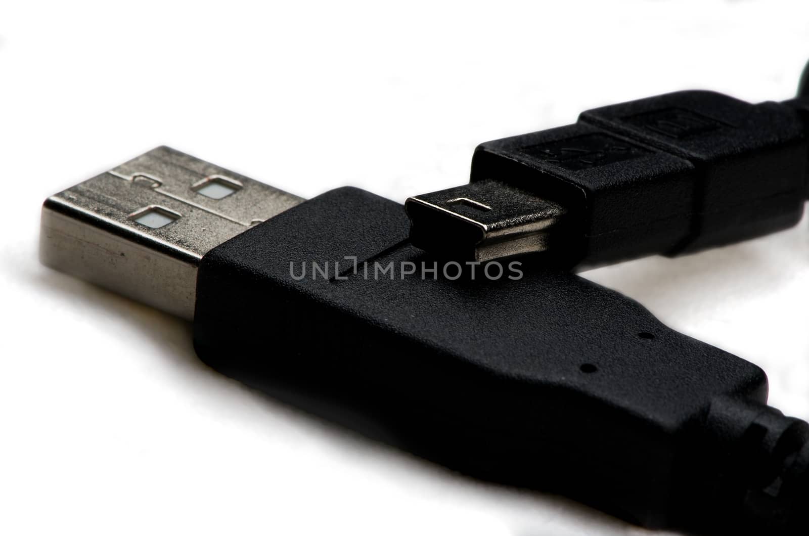 Computer USB connector on white background, hardware component