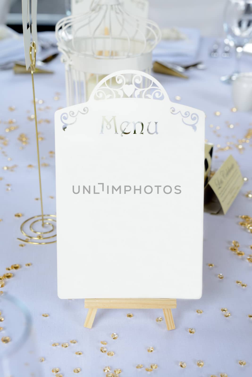 Wedding reception table details with menu closeup