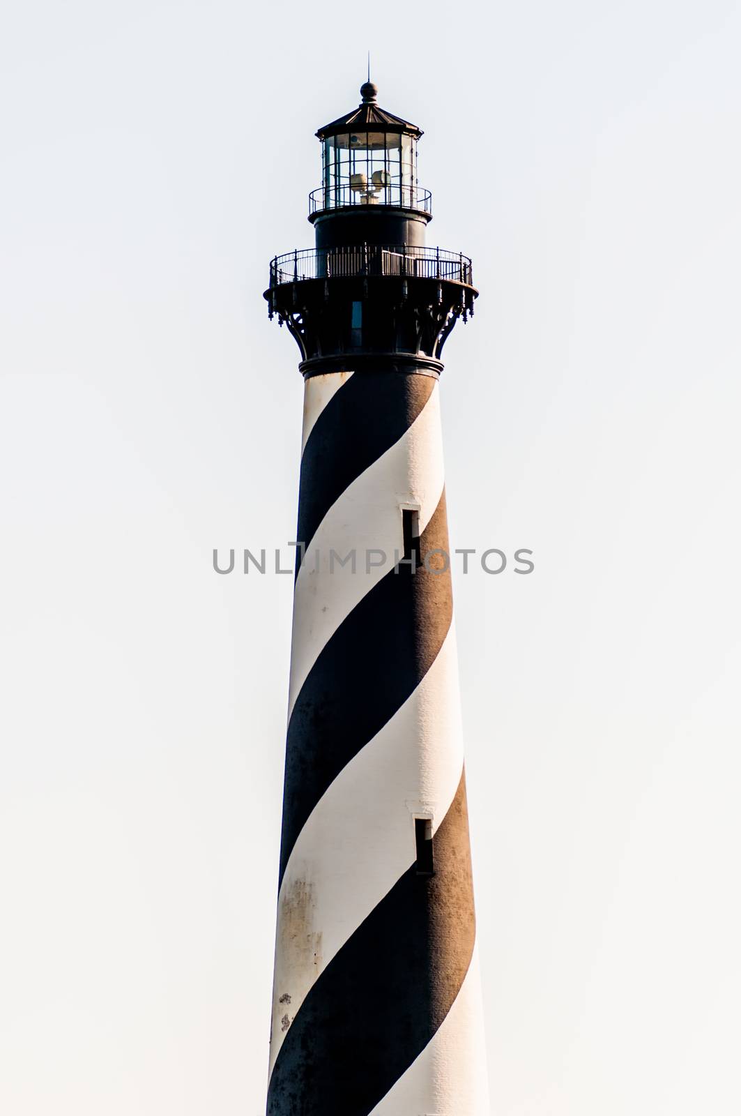 Diagonal black and white stripes mark the Cape Hatteras lighthou by digidreamgrafix