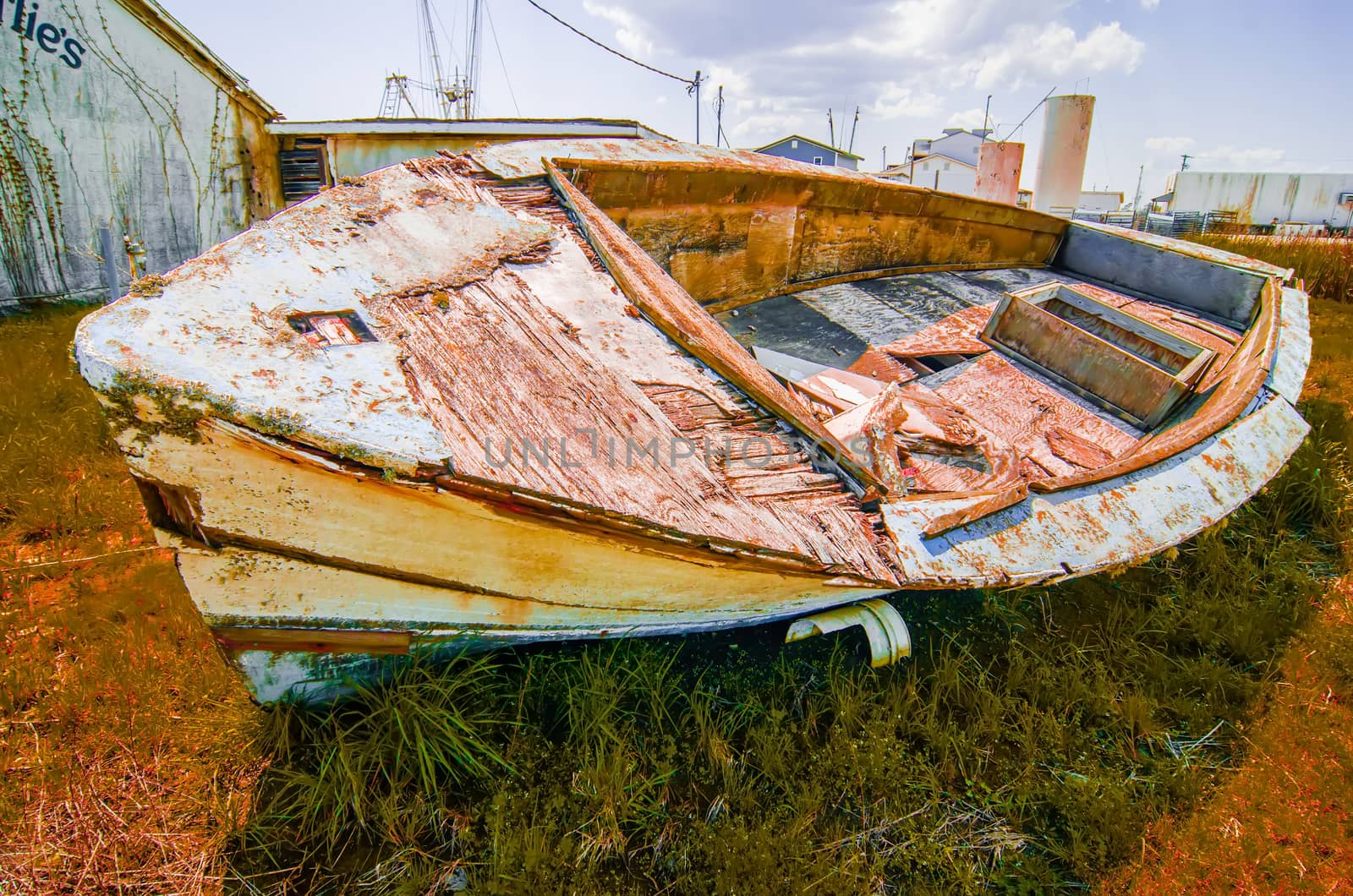 old rotten abandoned row boat on land by digidreamgrafix