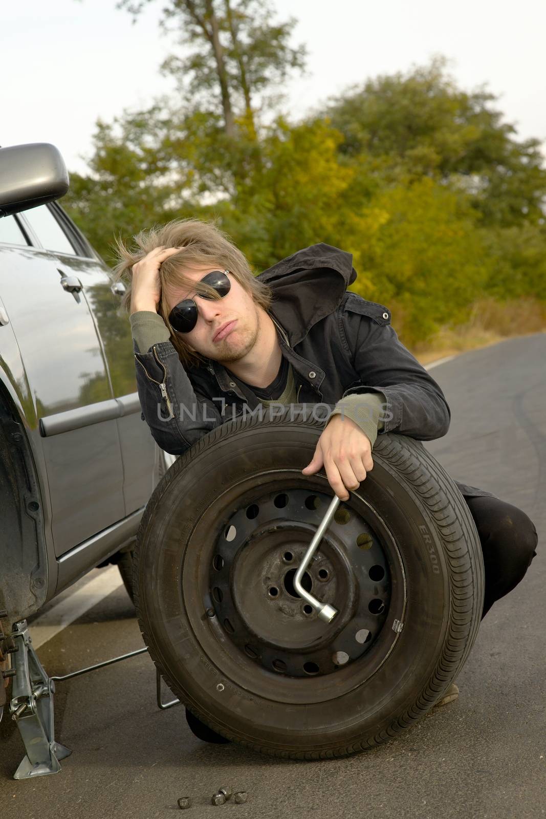 Man with wheel on the road