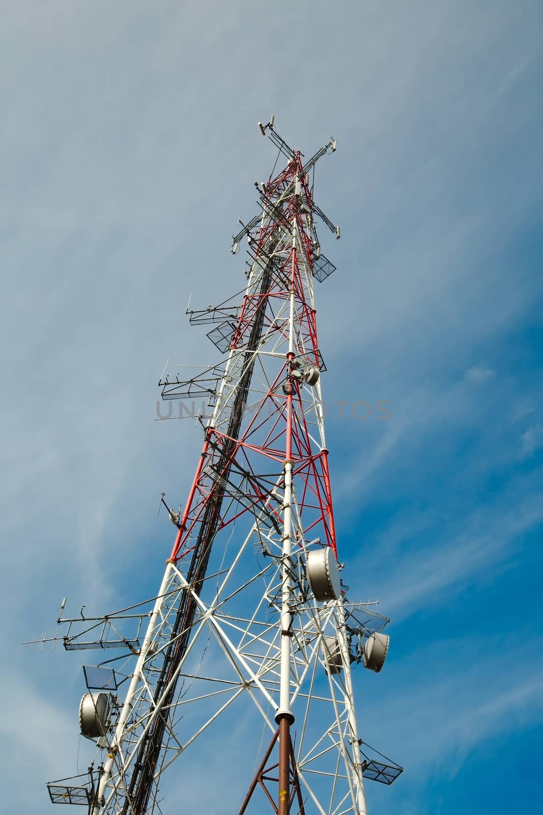 Communication transmitter tower against clear blue sky