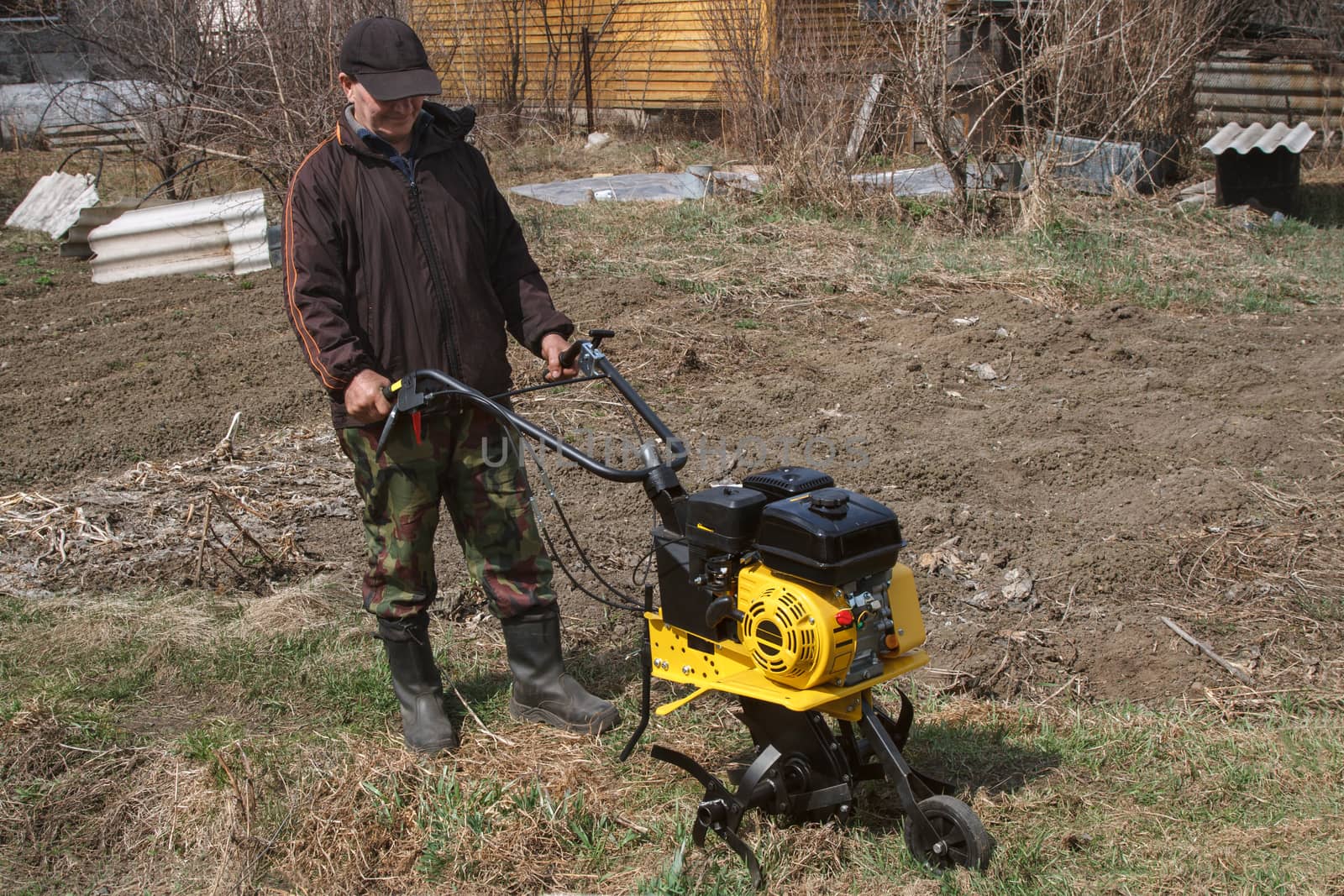 Man and new cultivator motor
