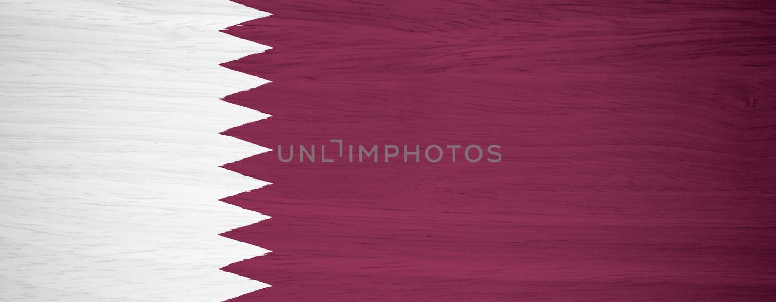 Qatar flag on wood texture by pinkblue